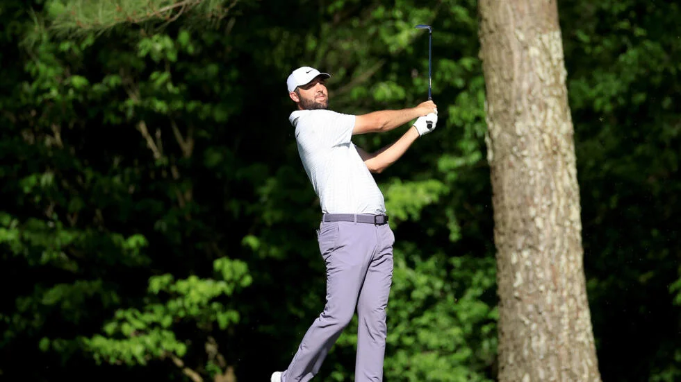Scheffler takes charge at Masters, Woods struggles