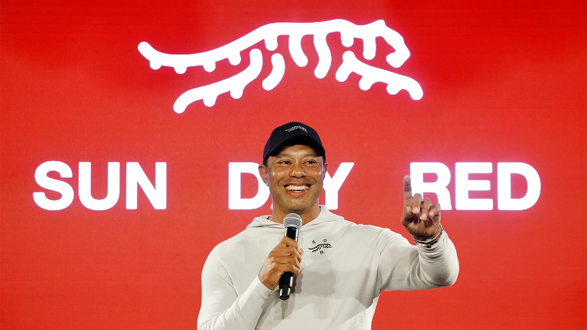 Woods partners with TaylorMade to launch Sun Day Red apparel brand.