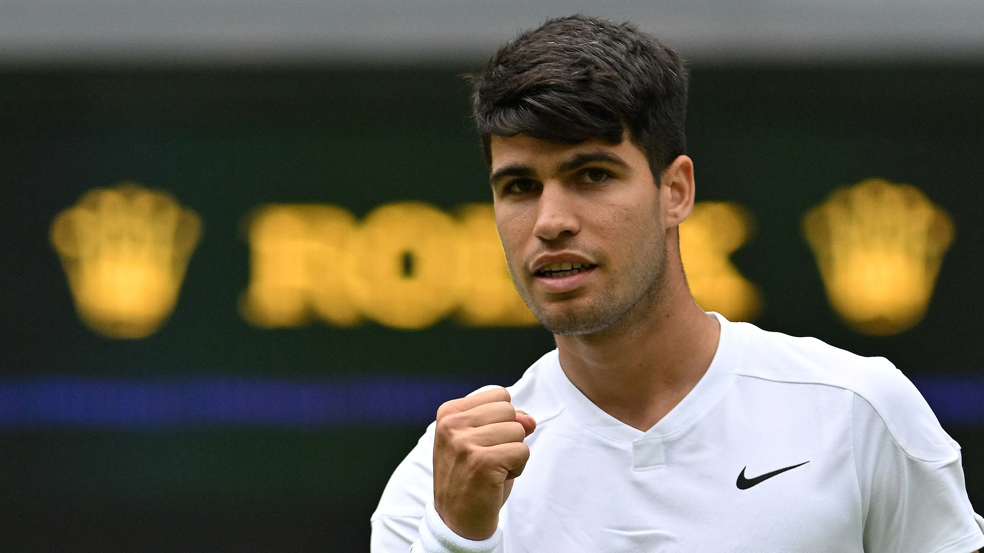 Defending champion Alcaraz sees off spirited Lajal to reach Wimbledon second round