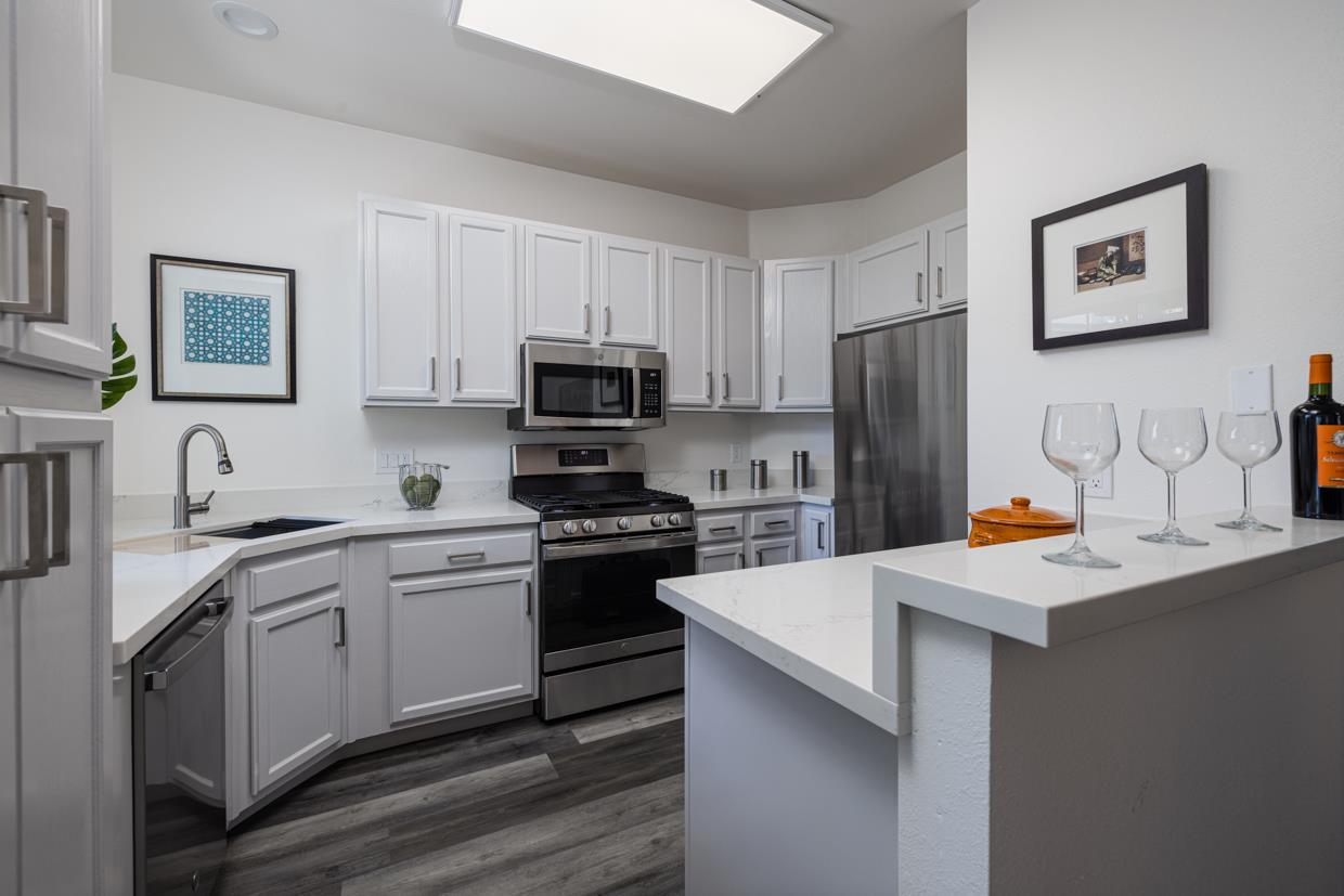 A white kitchen renovated with new appliances