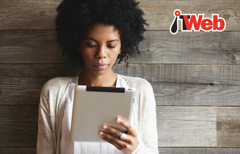IT Web image of woman reading an article on her tablet device
