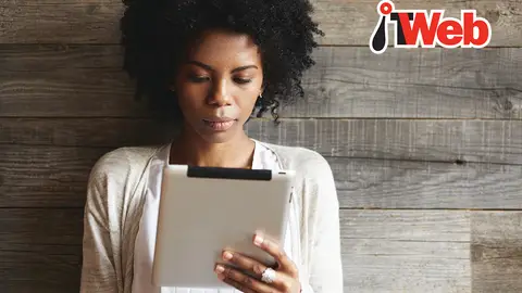 IT Web image of woman reading an article on her tablet device