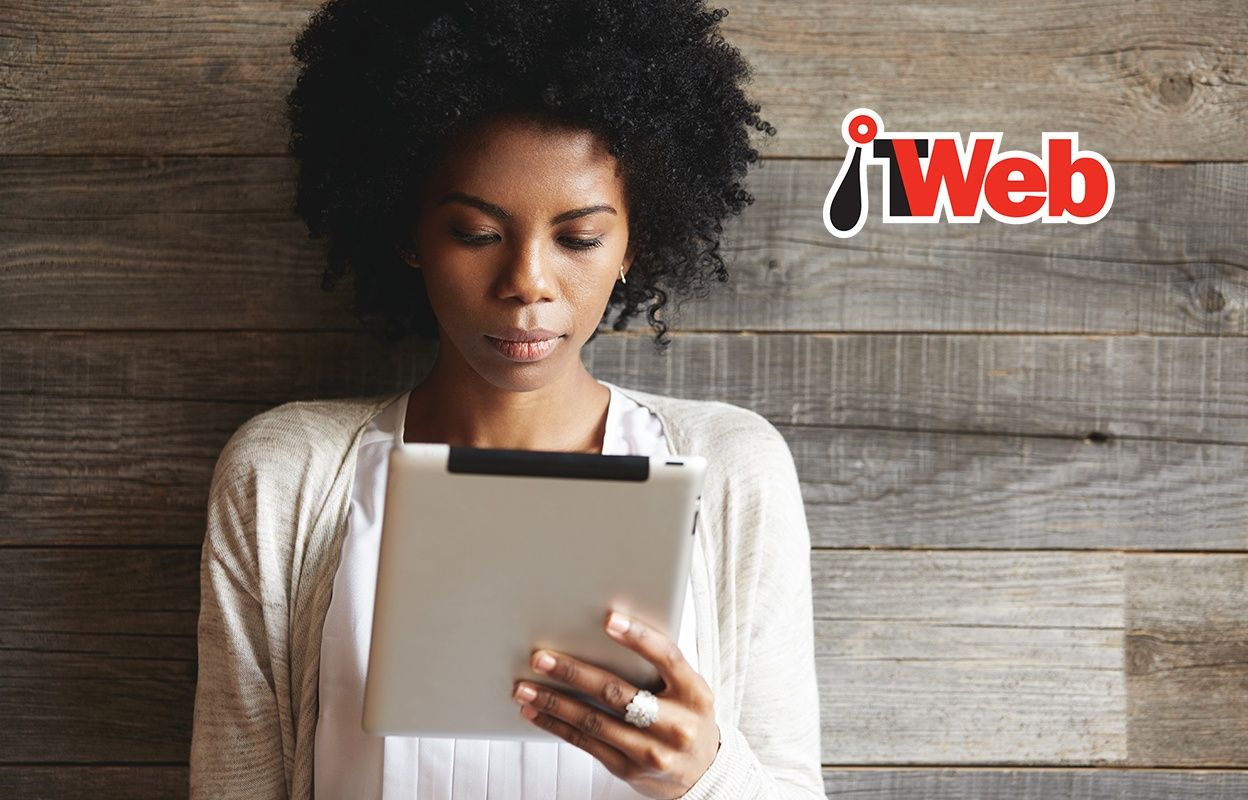 IT Web image of woman reading an article on her tablet device