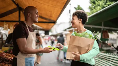 Women paying with Lesaka Card Reader