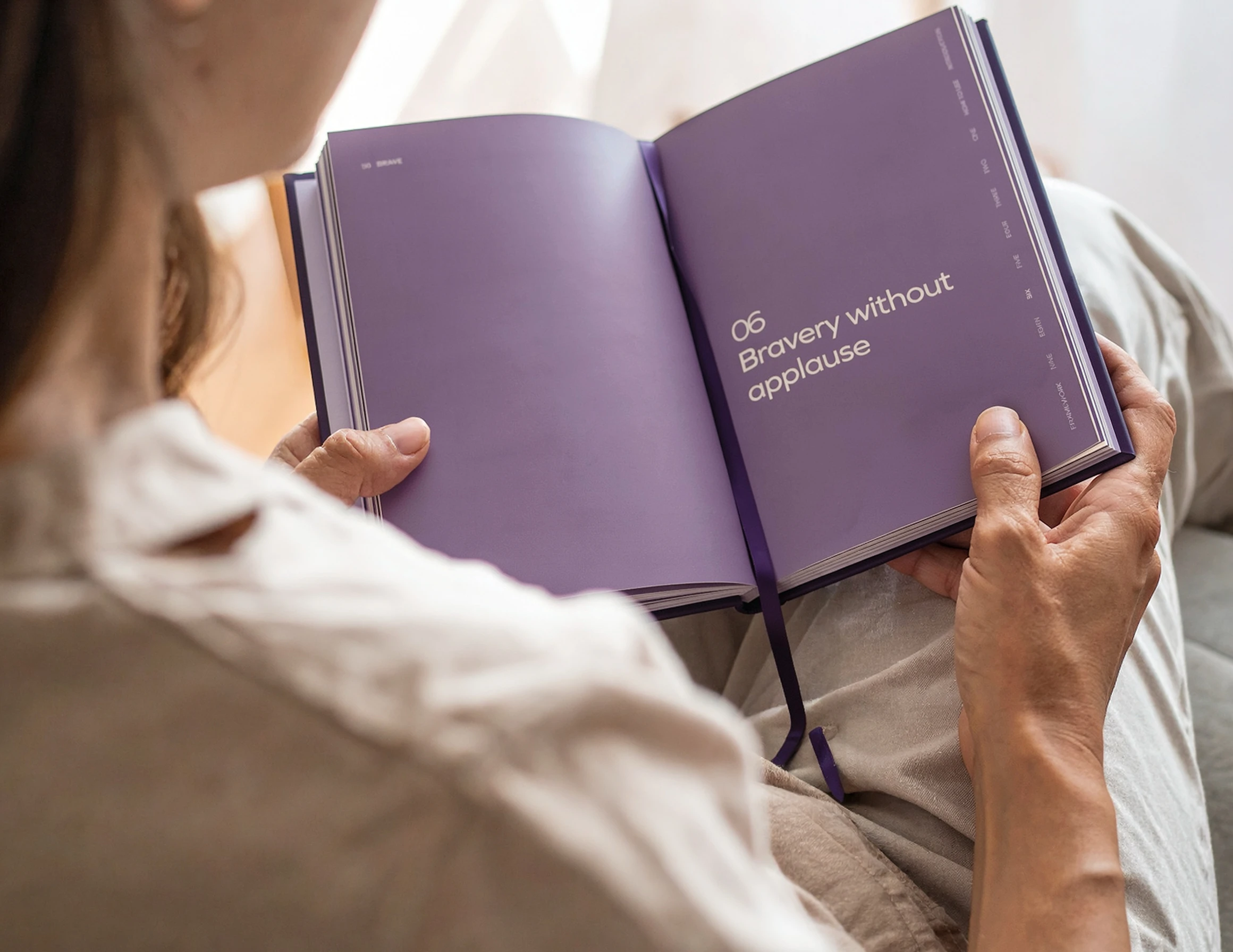 A woman reads Brave by Sharon Hartley