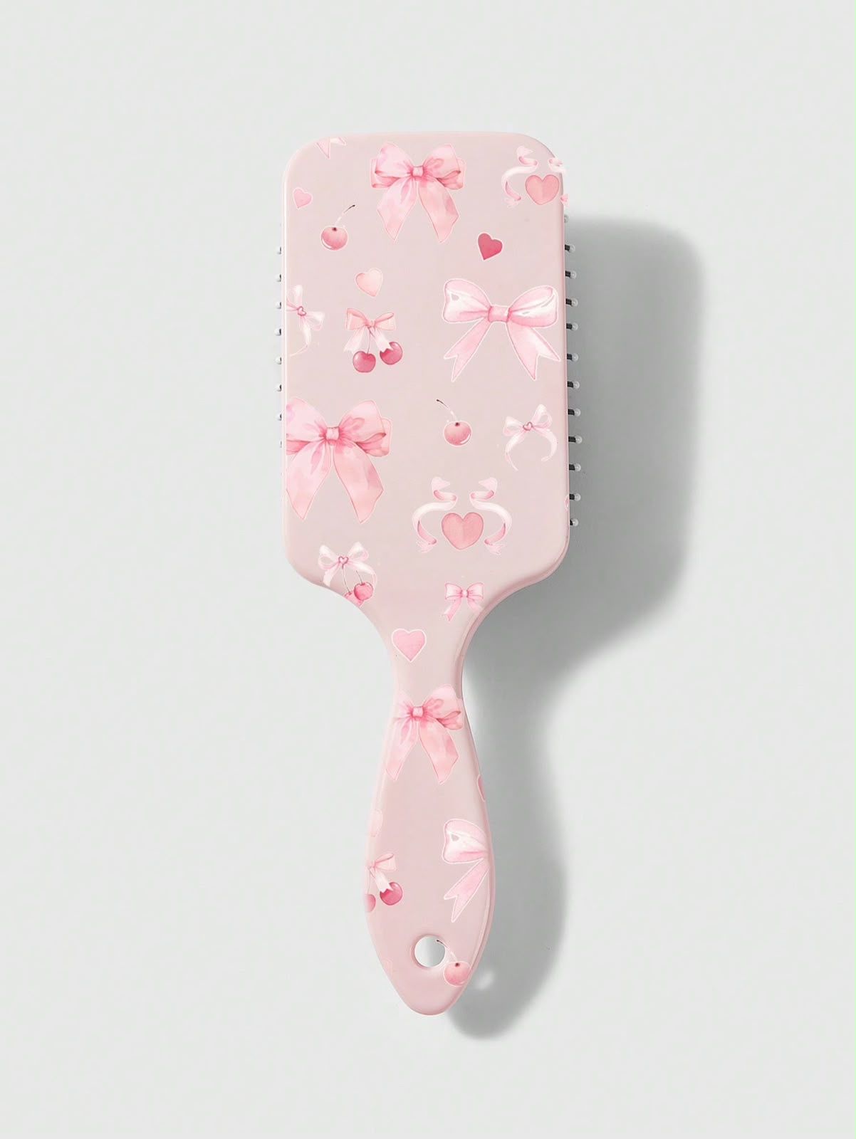 Peines rosa con lazos