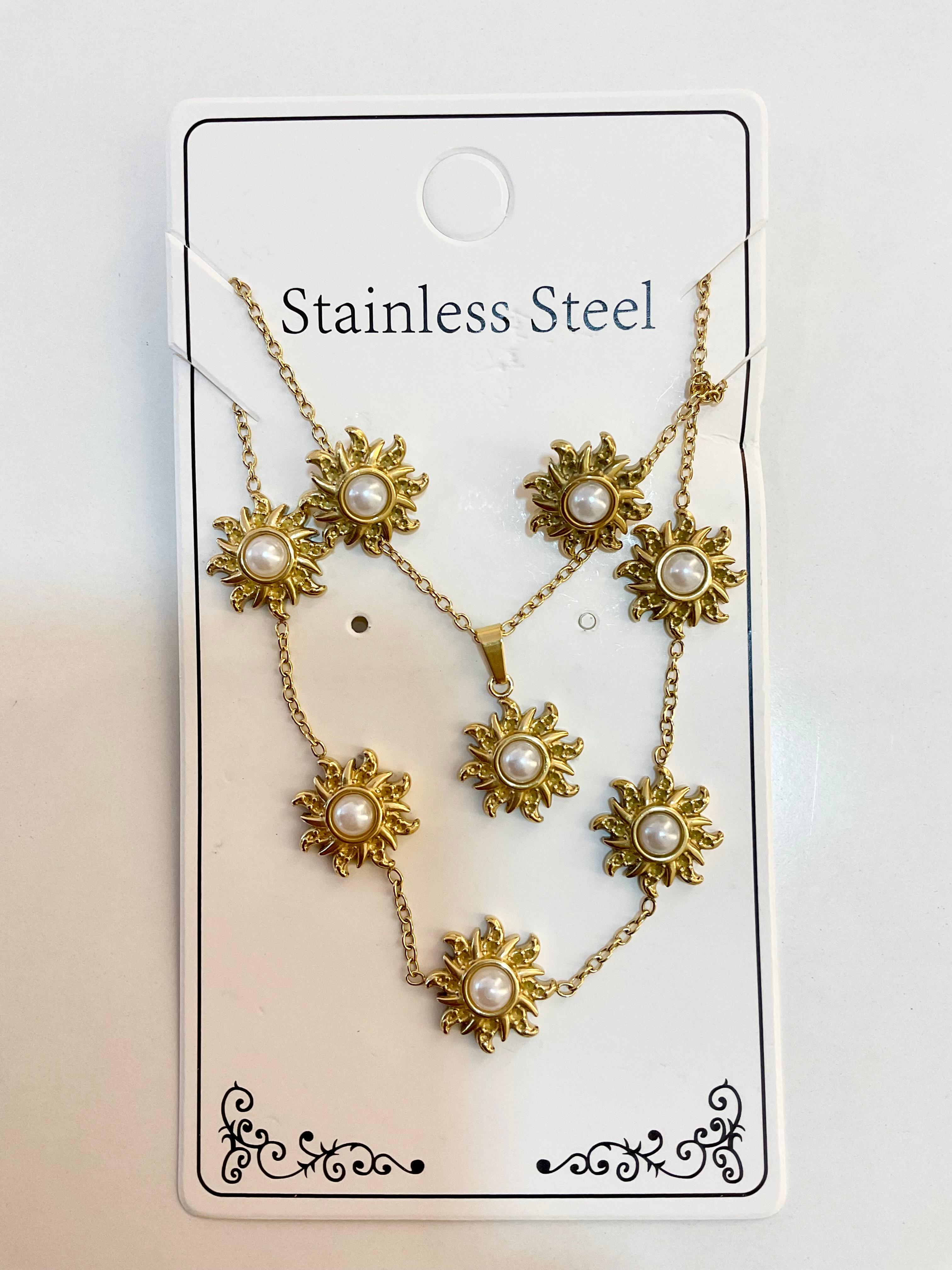 Set of chain bracelet and earrings with suns and with pearls