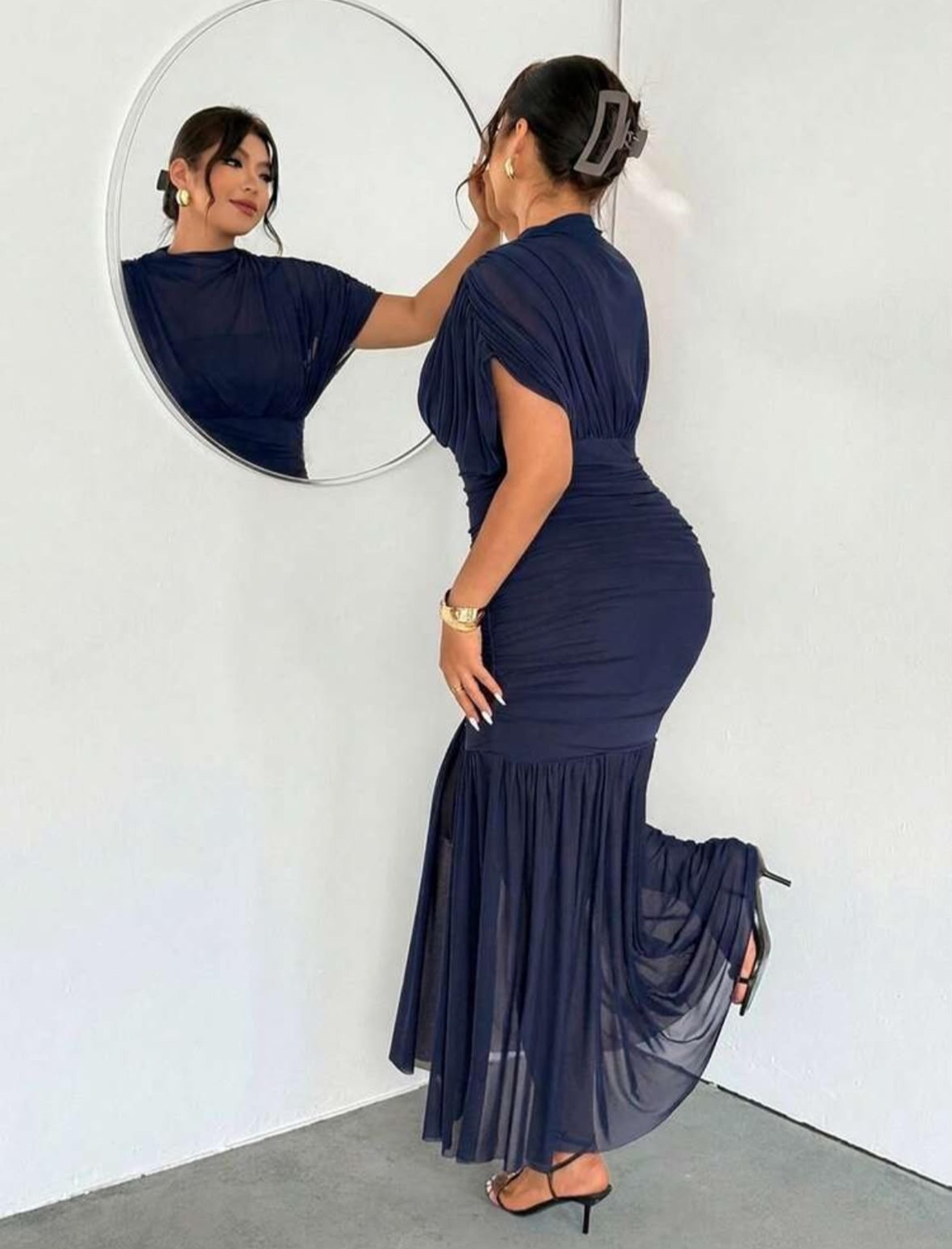 Long dress blown at the bottom — alternate view