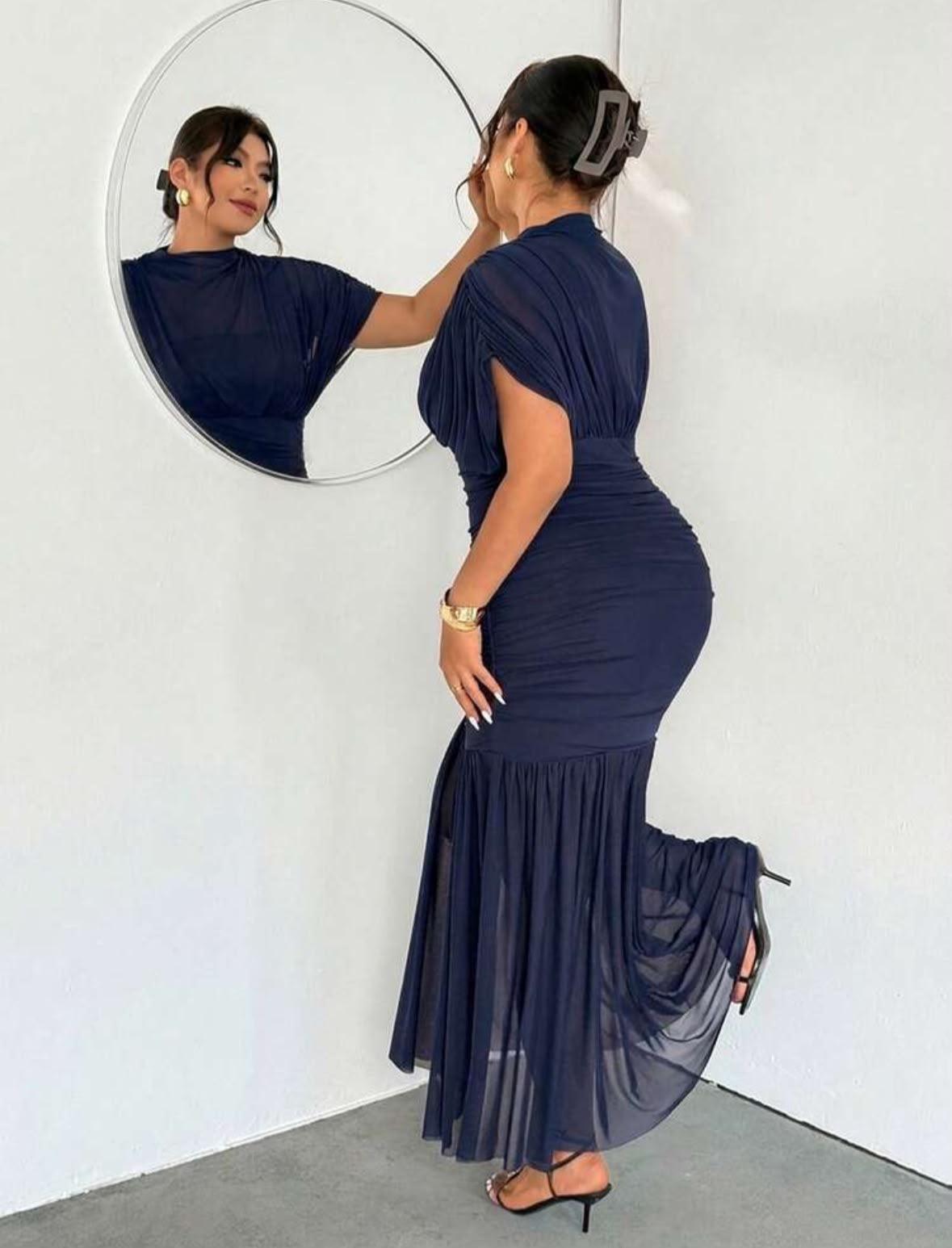 Long dress blown at the bottom — alternate view
