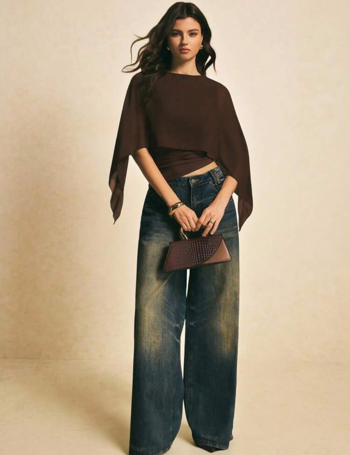 Shirt with cape on the shoulders