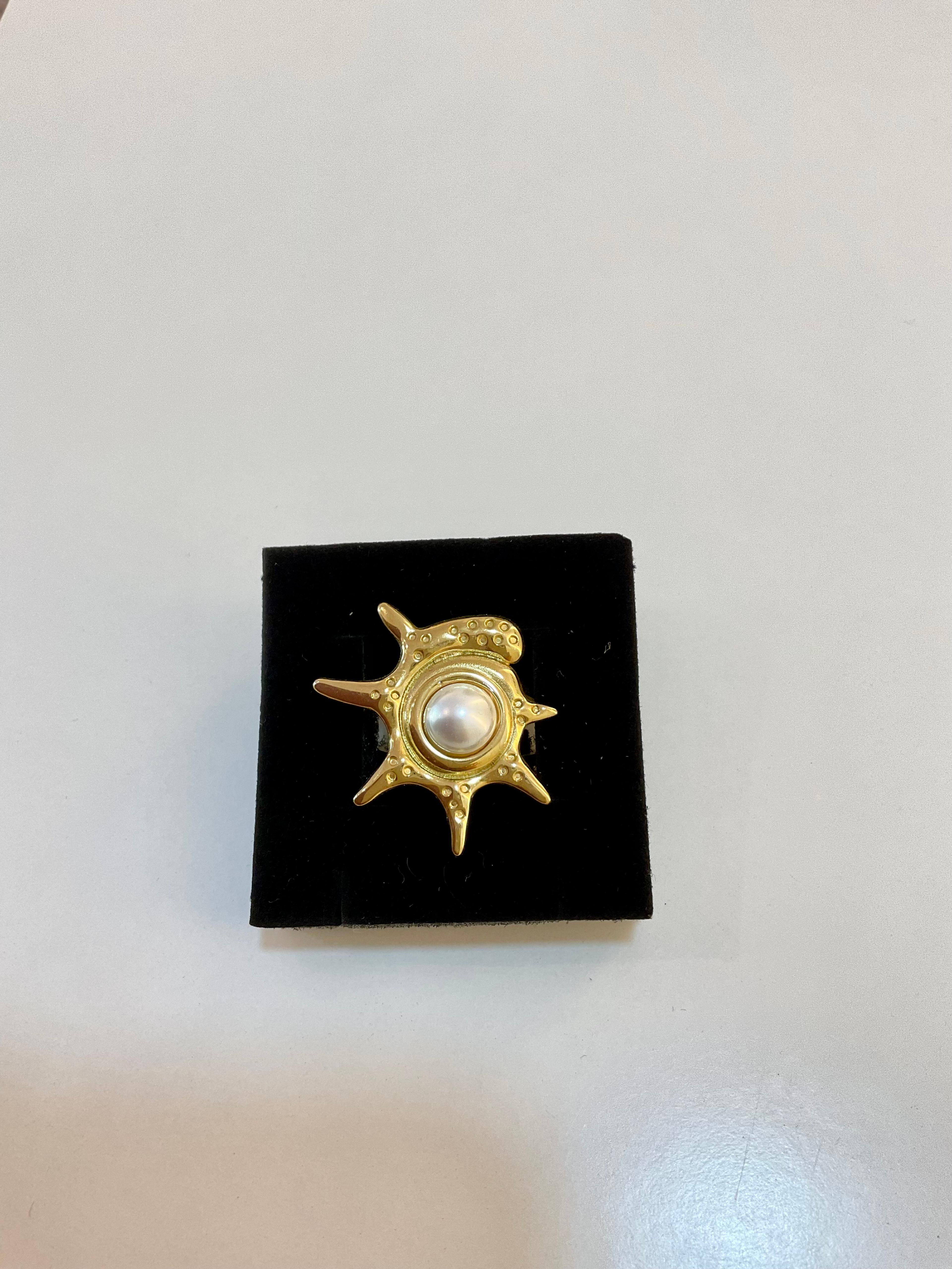 Ring with sun-shaped design