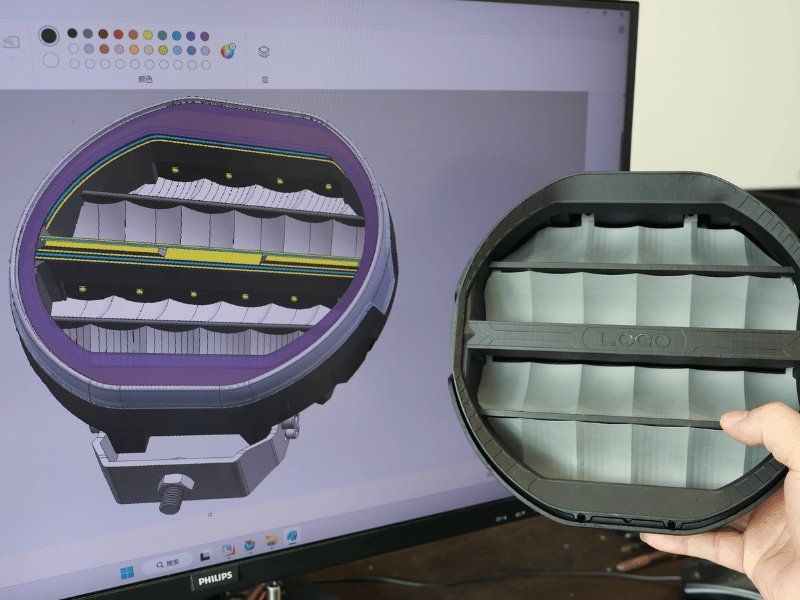 CAD cross-section of an LED driving light next to its die-cast housing