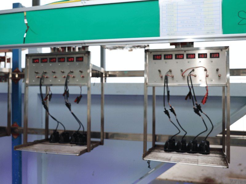 Forklift safety light drivers on the 12V/24V alternating-voltage burn-in rack at the Tough Lighting factory