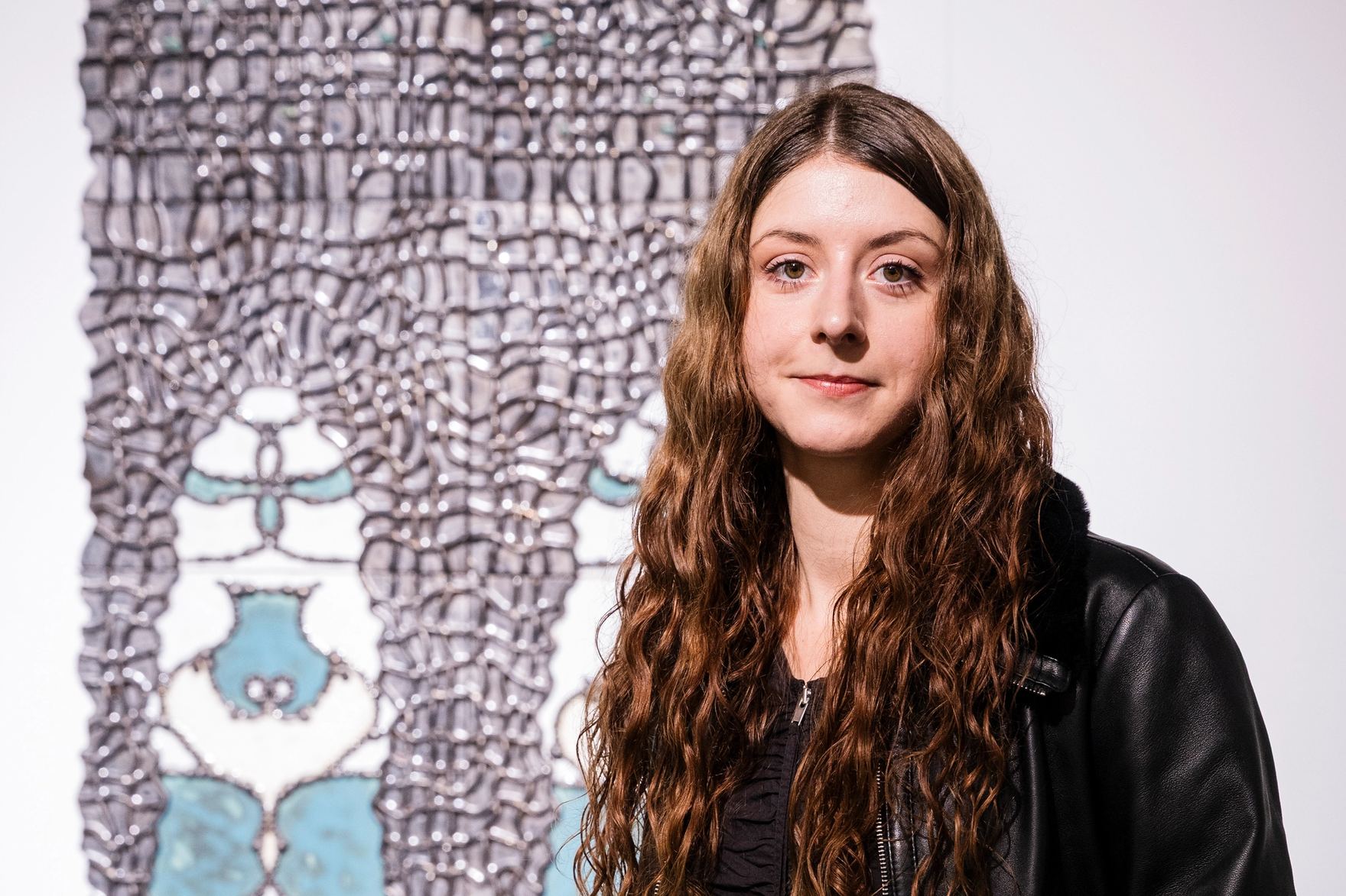 Marie Pic in front of her work of art