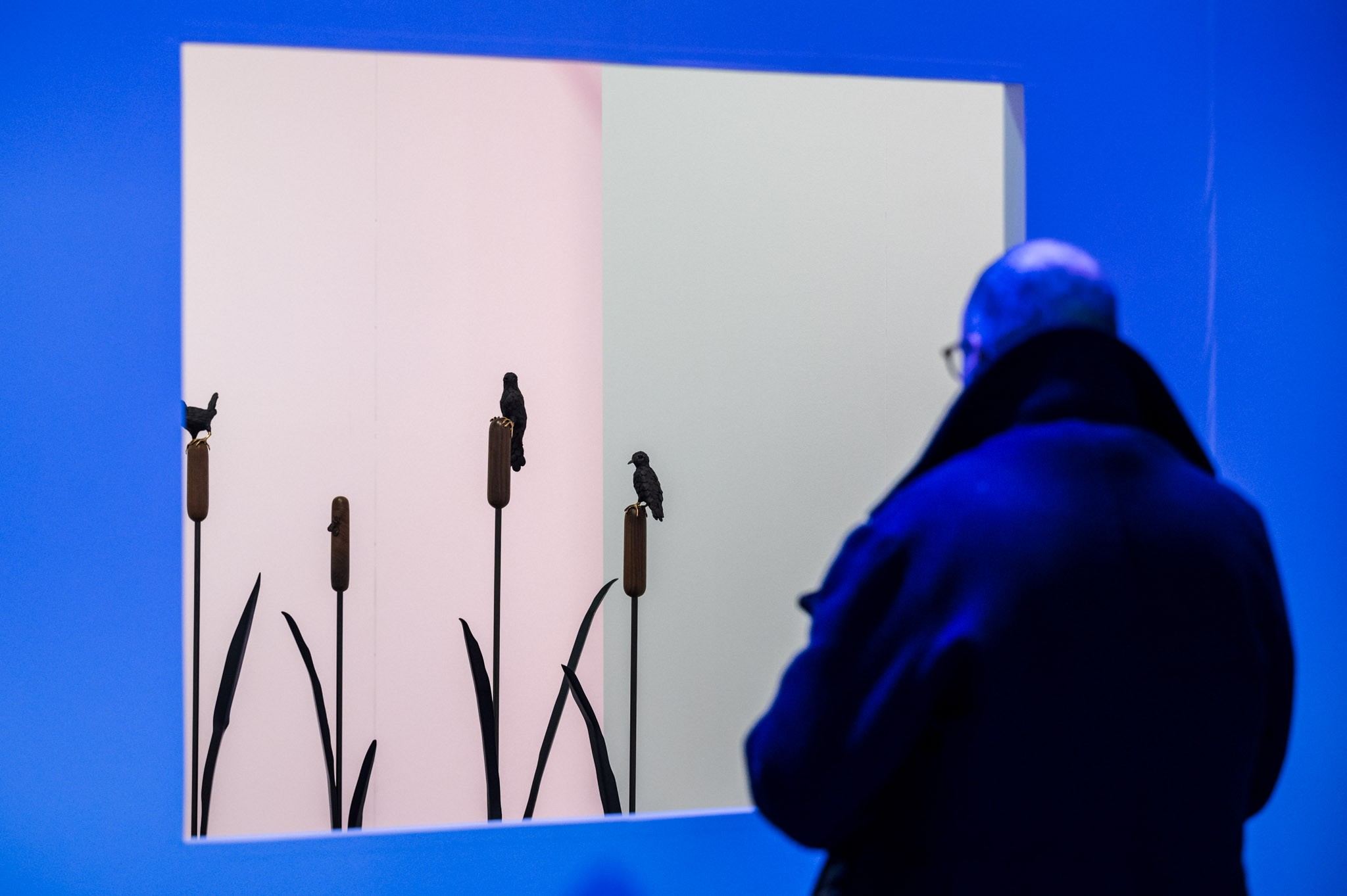 people in front of ceramic work of art 