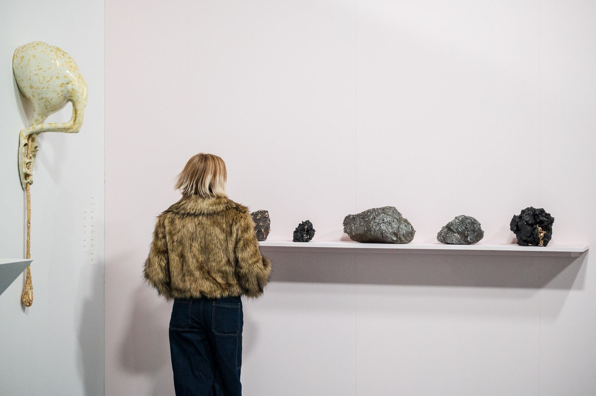 people in front of ceramic work of art 