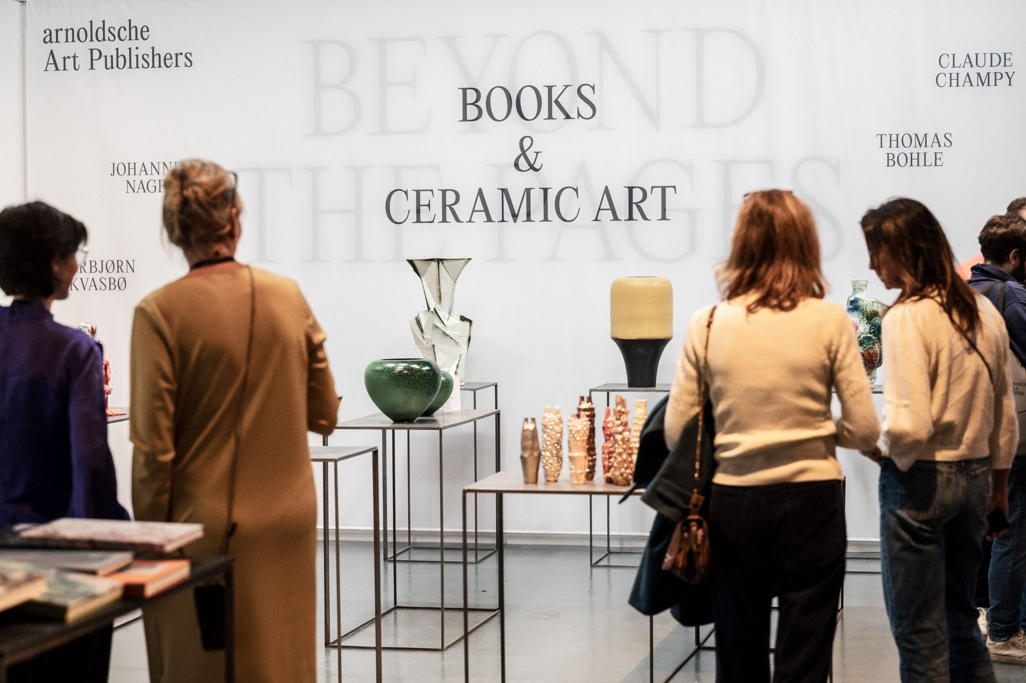 people in front of ceramic work of art 