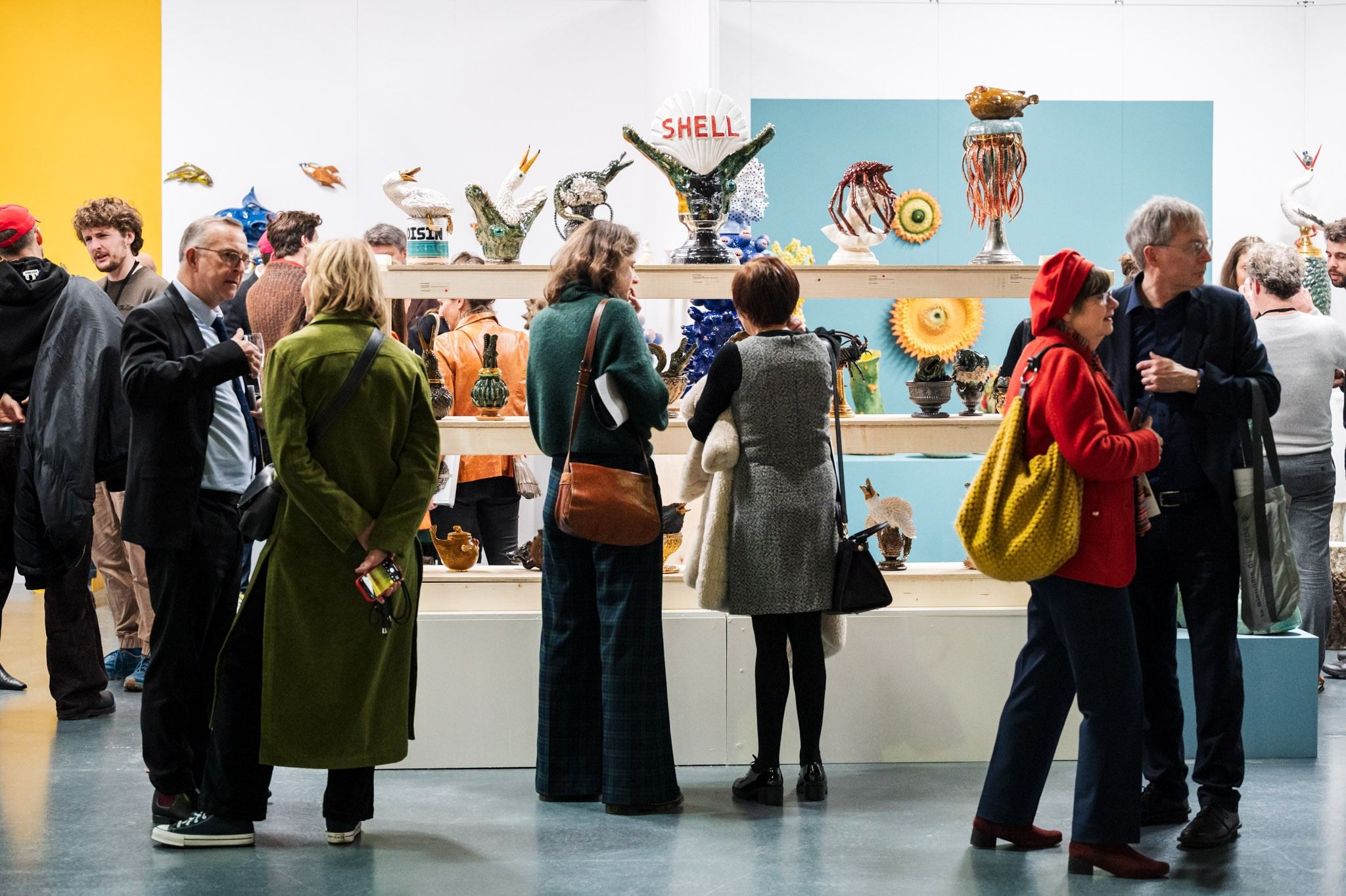 people in front of ceramic work of art 