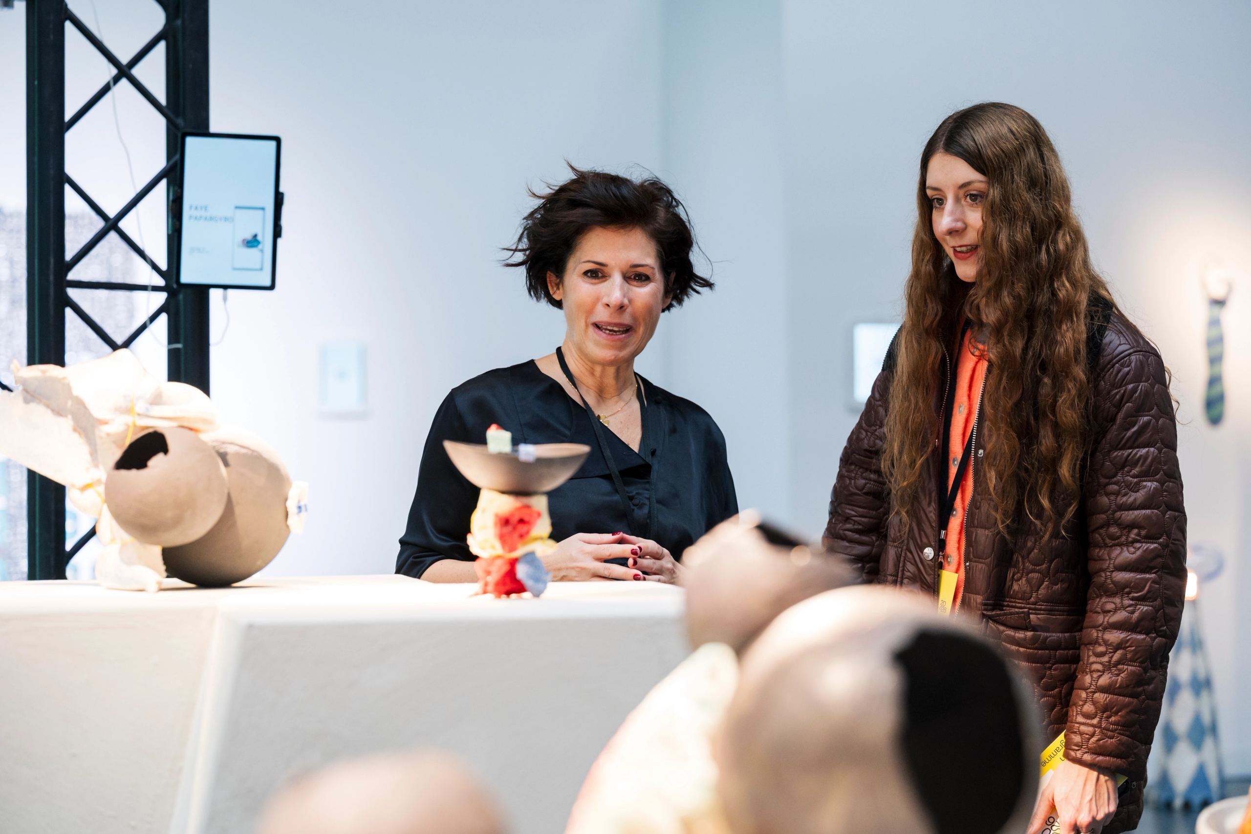 people in front of the art prize section of ceramic brussels 