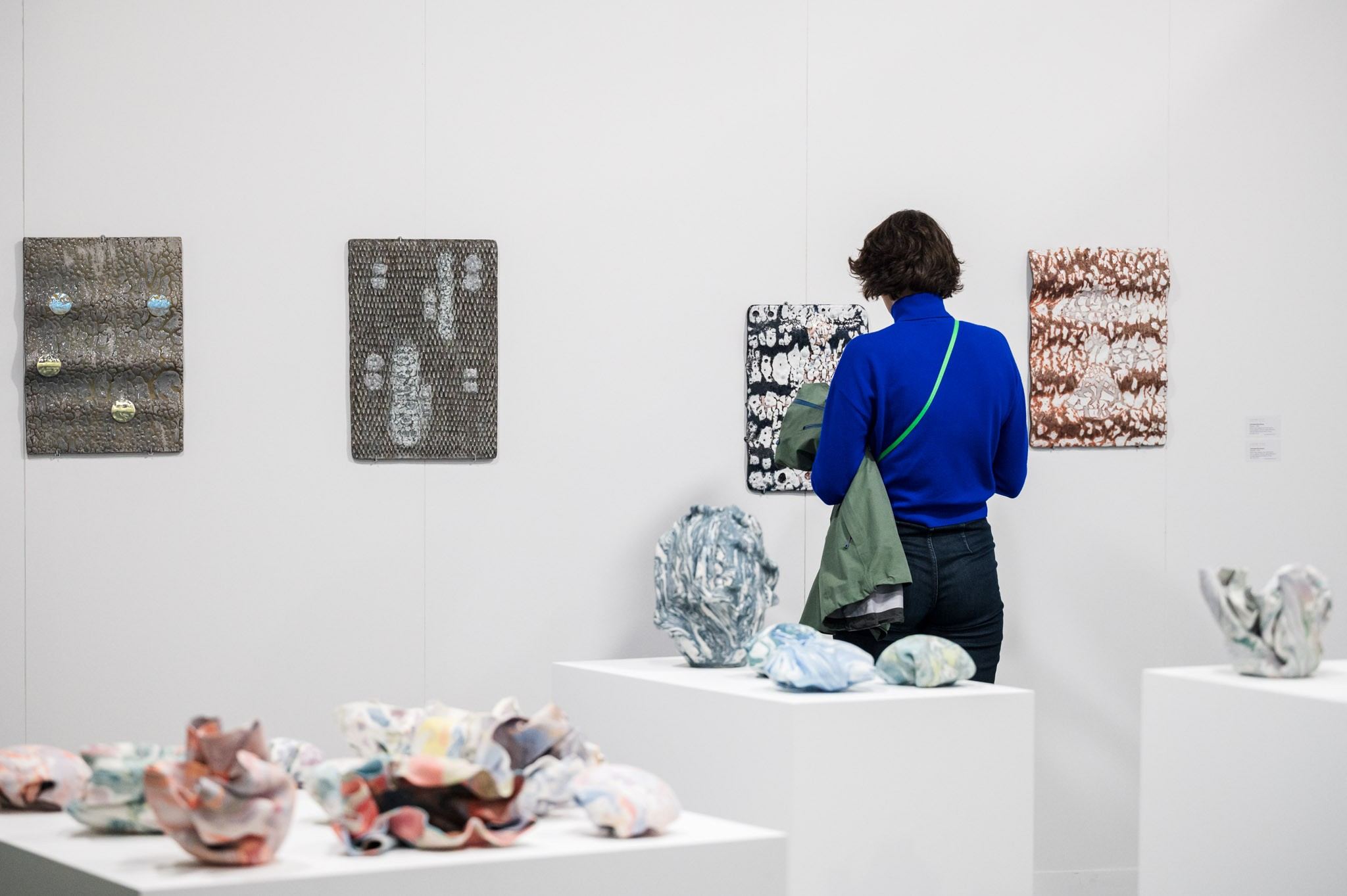 people in front of ceramic work of art 