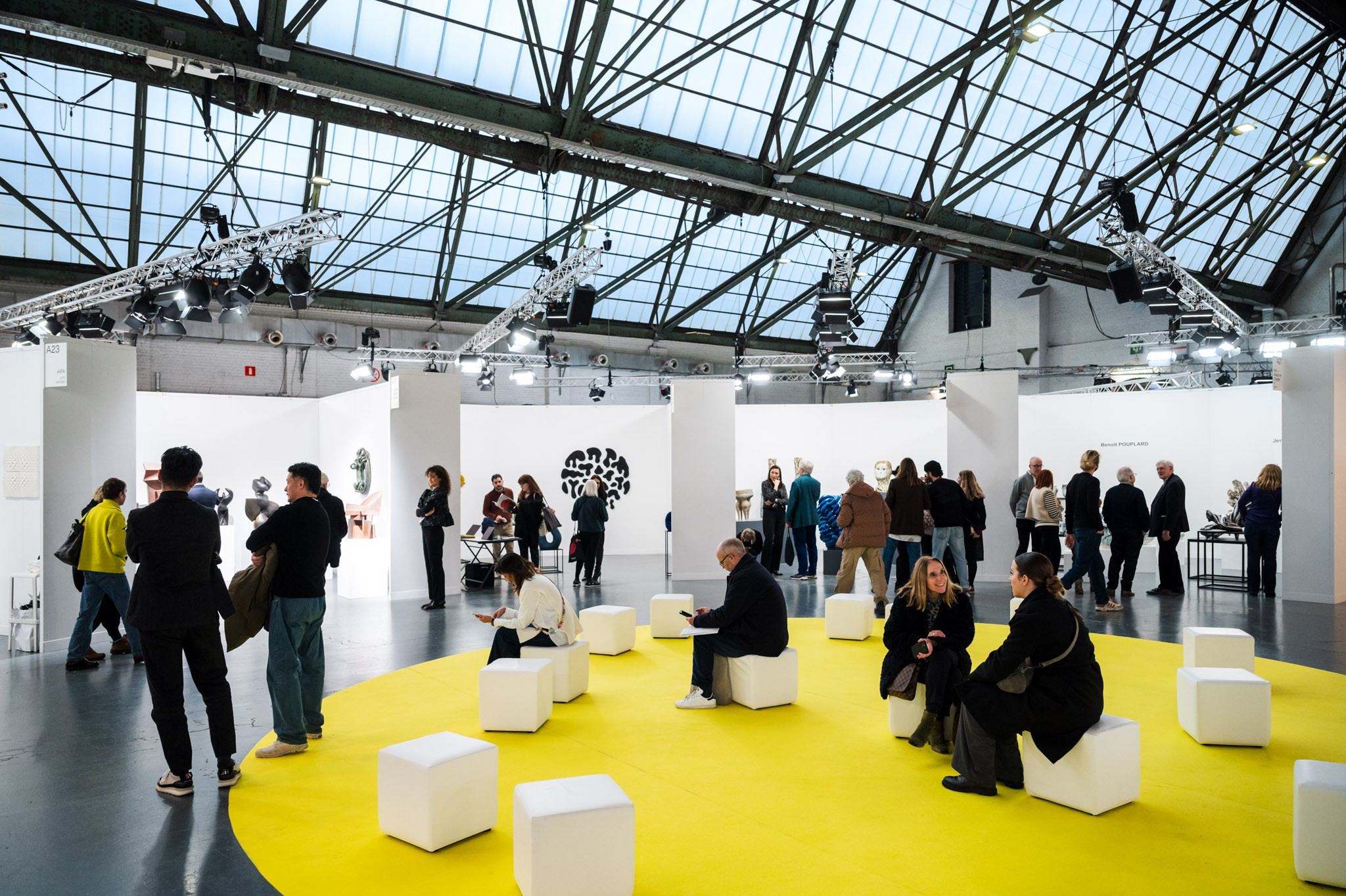 people in front of ceramic work of art 