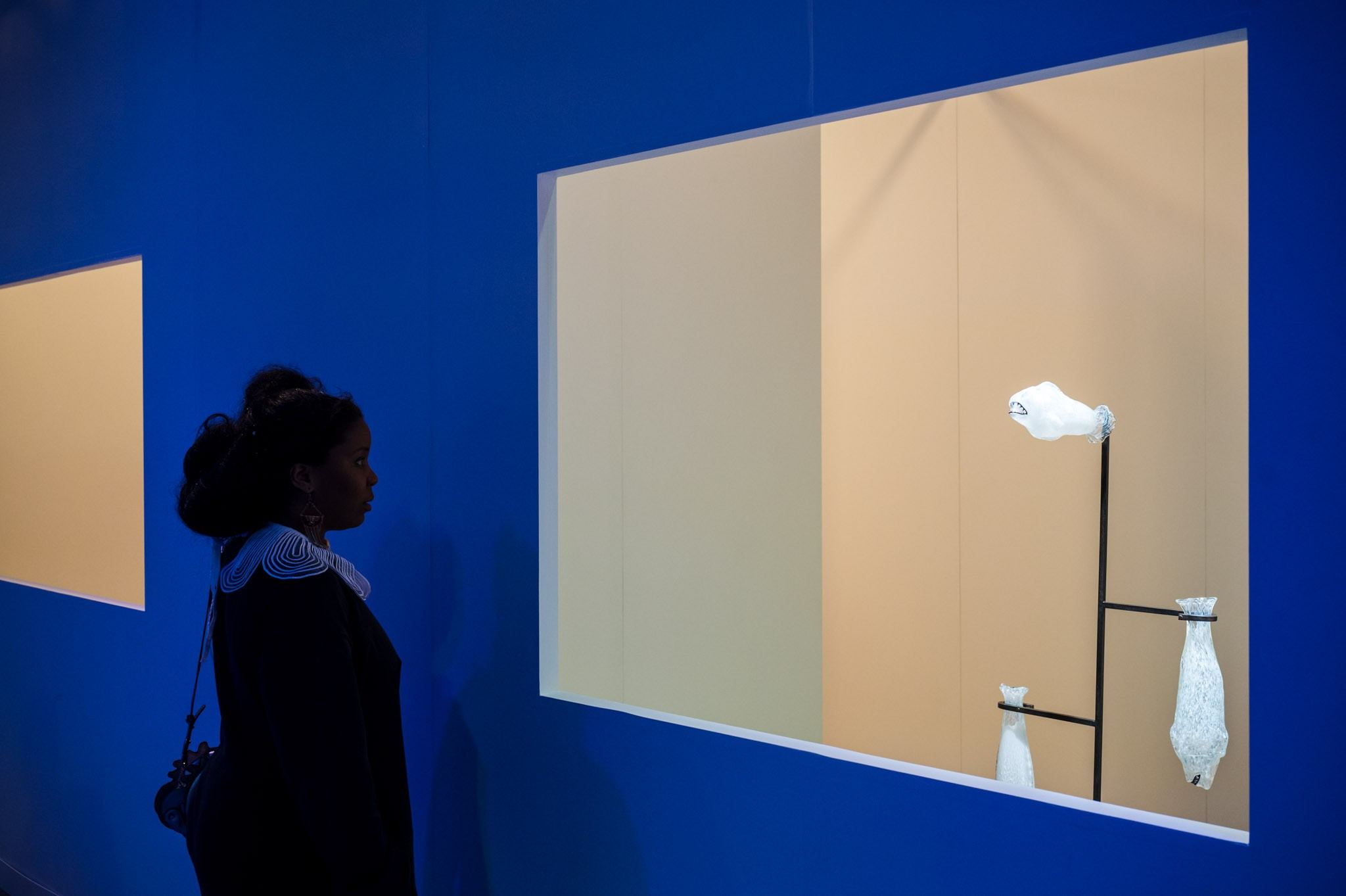 people in front of ceramic work of art 