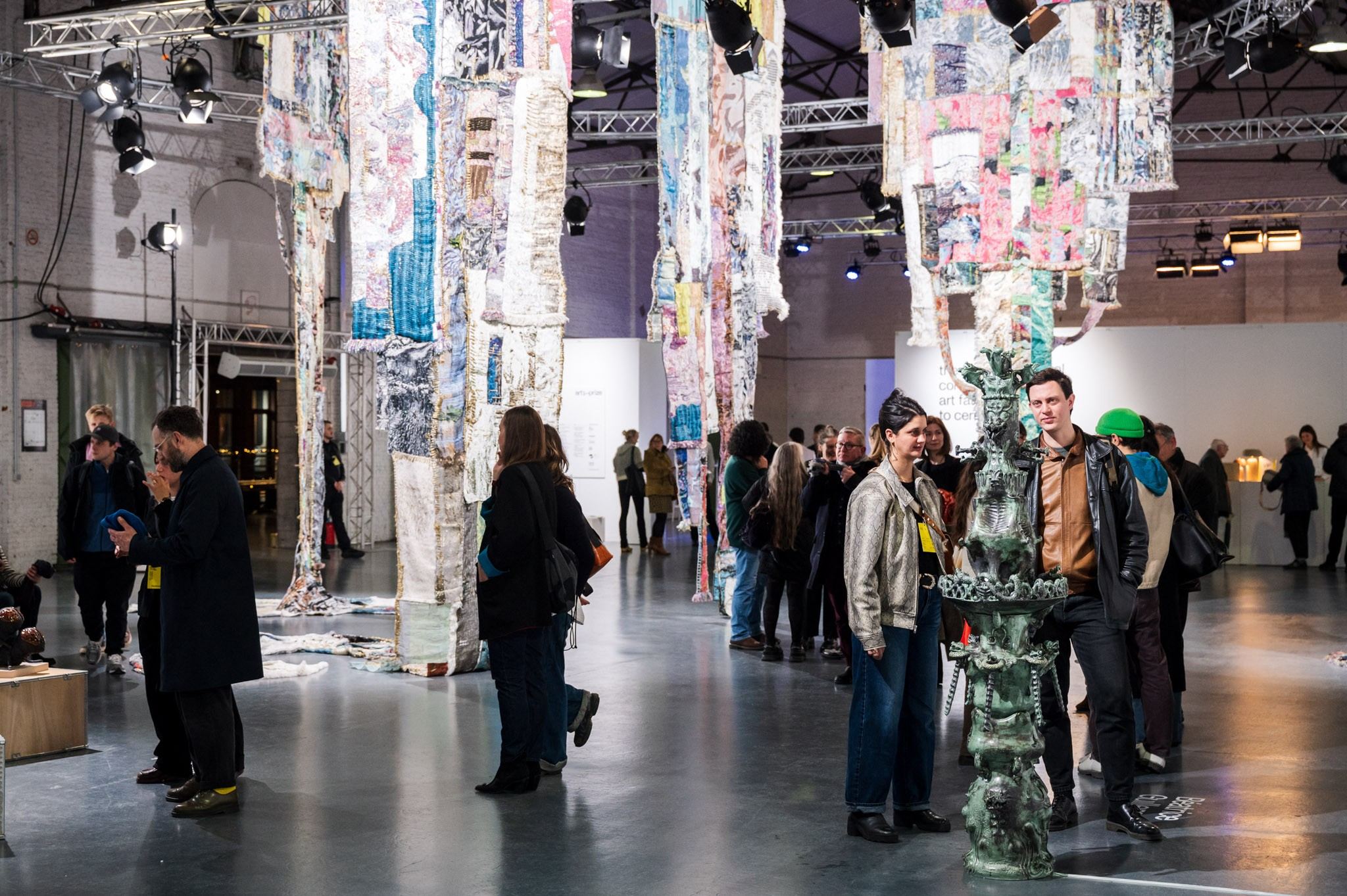 people in front of ceramic work of art 