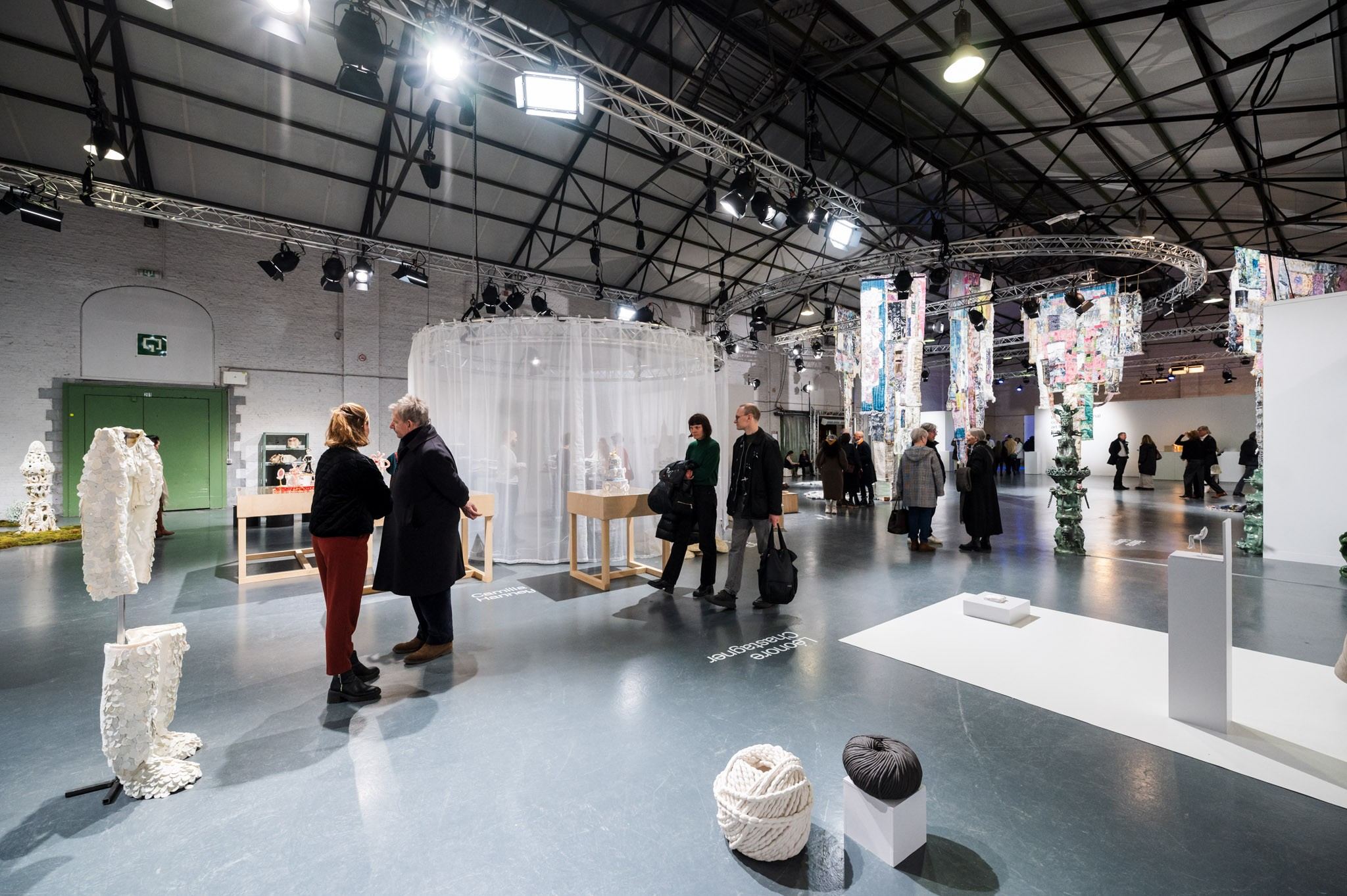 people in front of ceramic work of art 