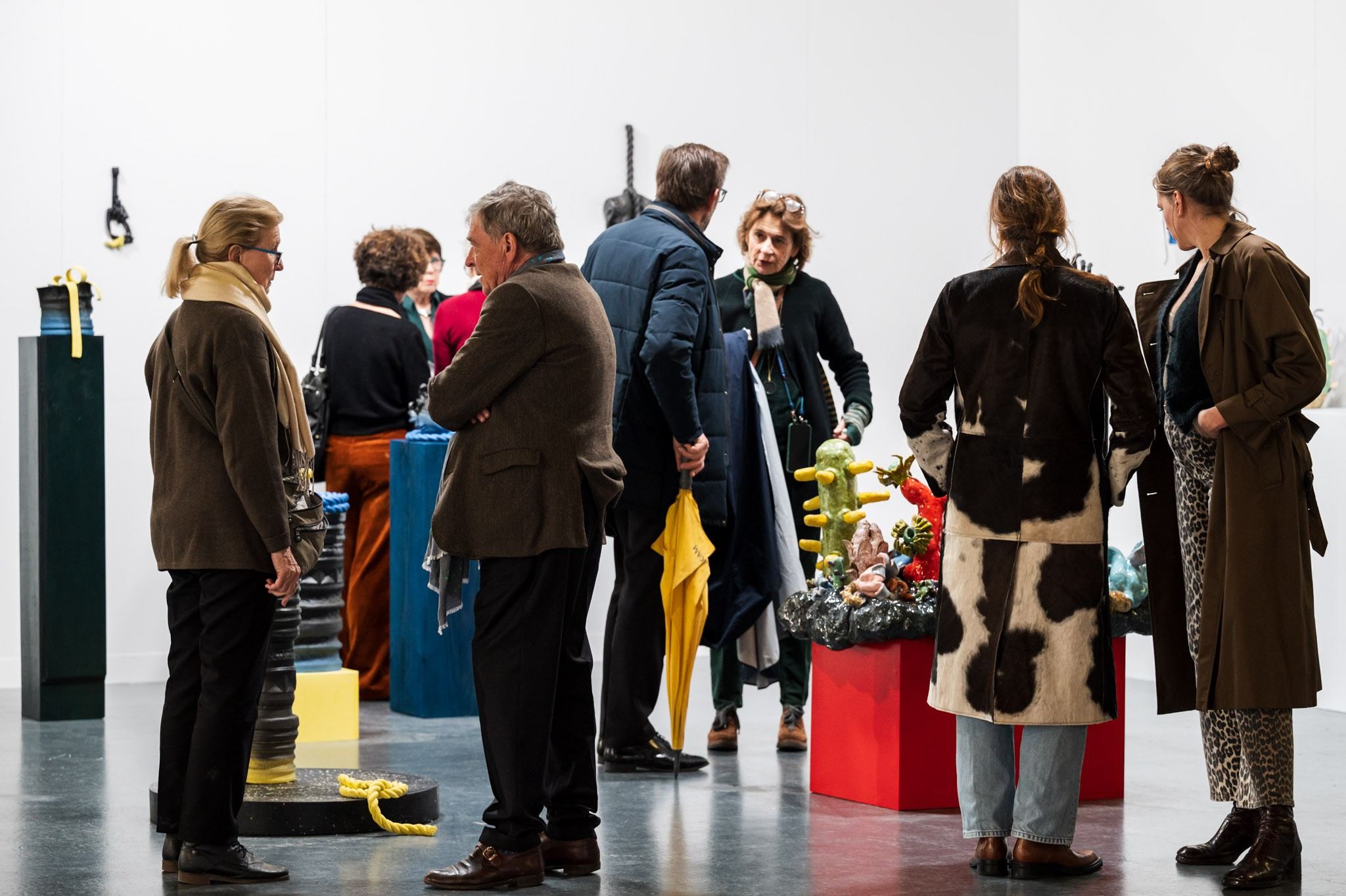 people in front of ceramic work of art 