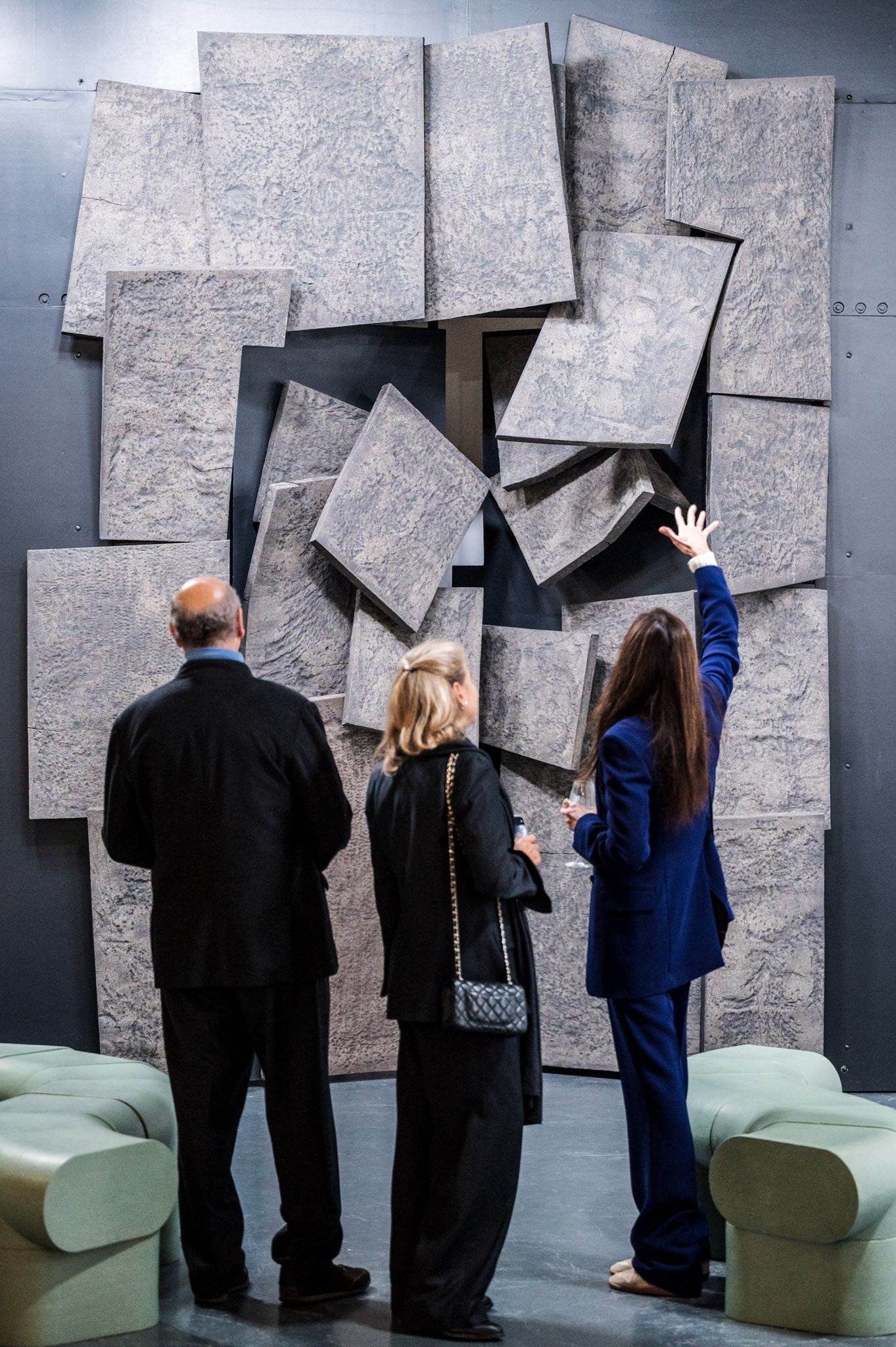 people in front of ceramic work of art 