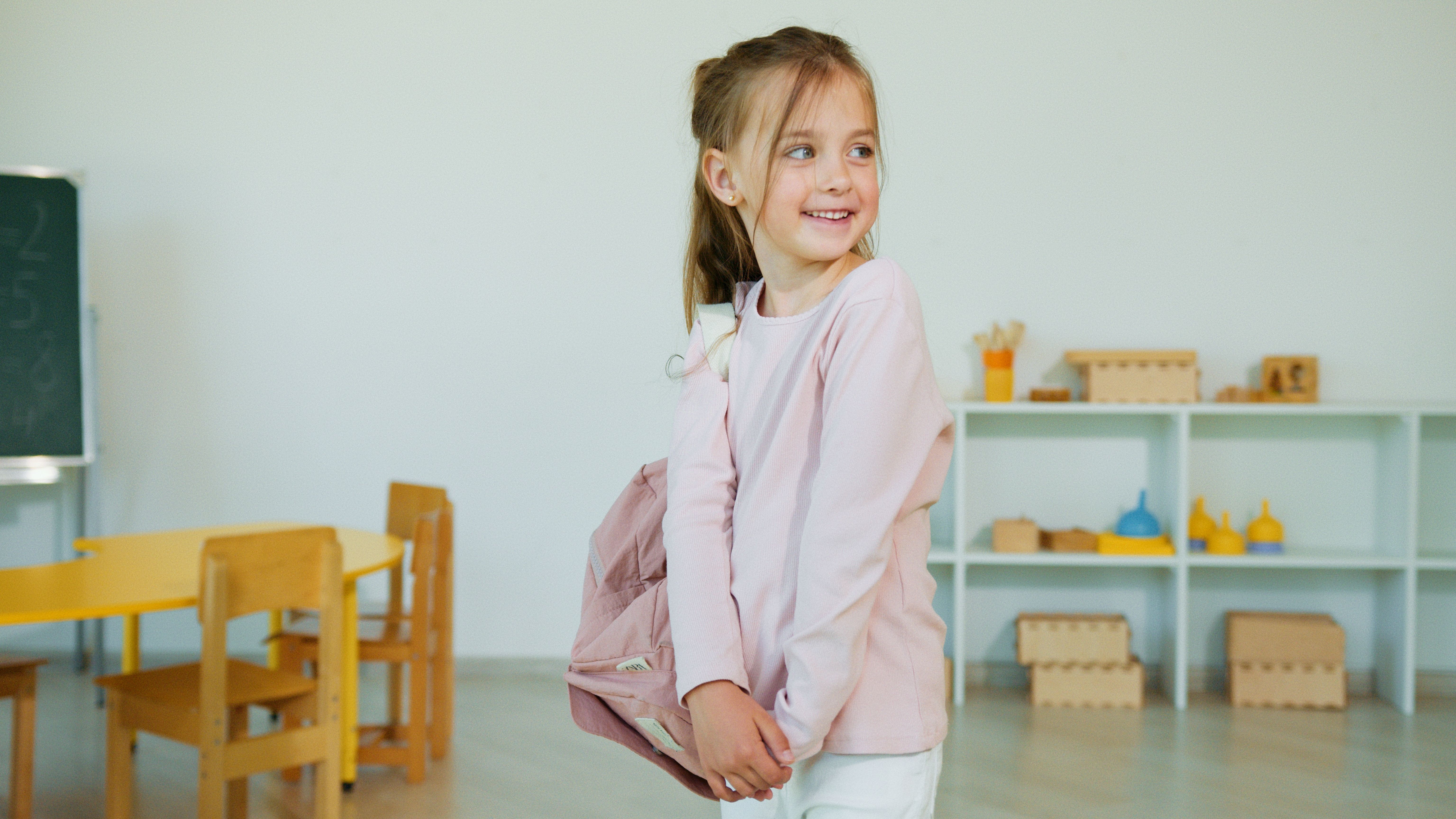 A happy girl carrying bag pack - Neelcamp, camp stories