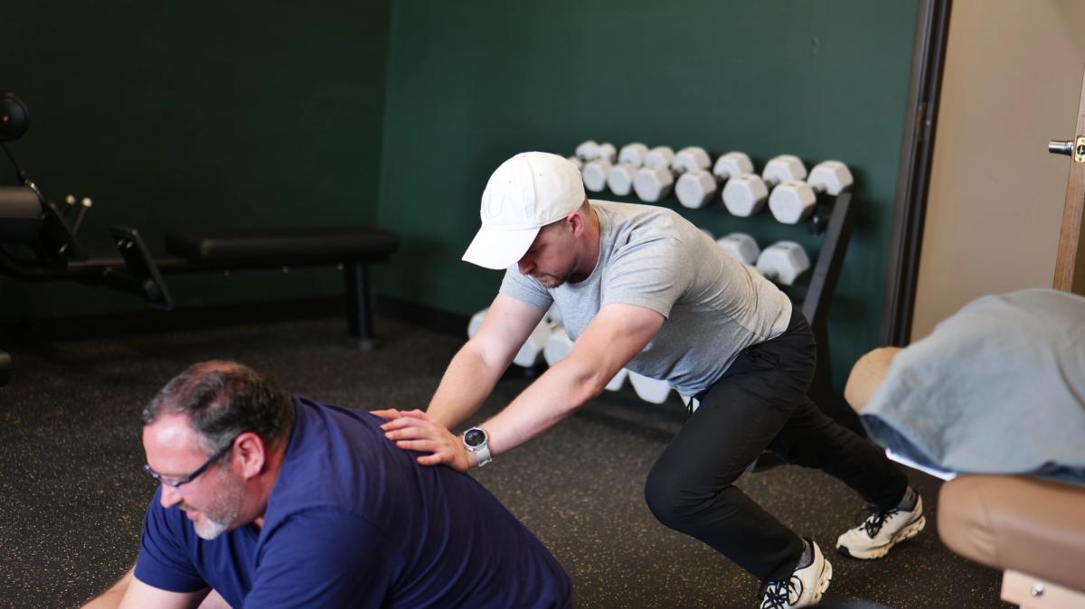 Hands-on manual therapy during a clinic visit