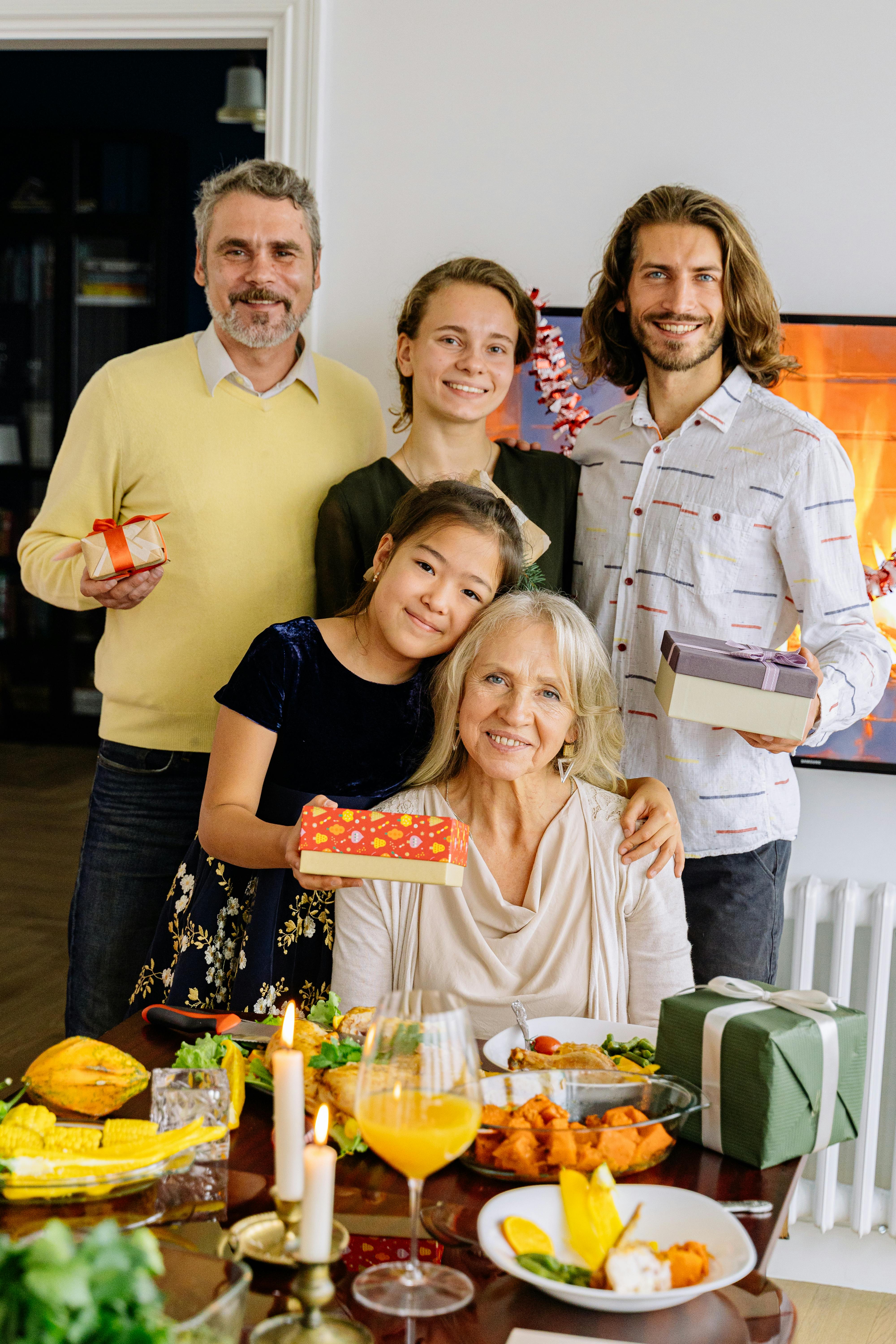 Family celebrating with food and gifts