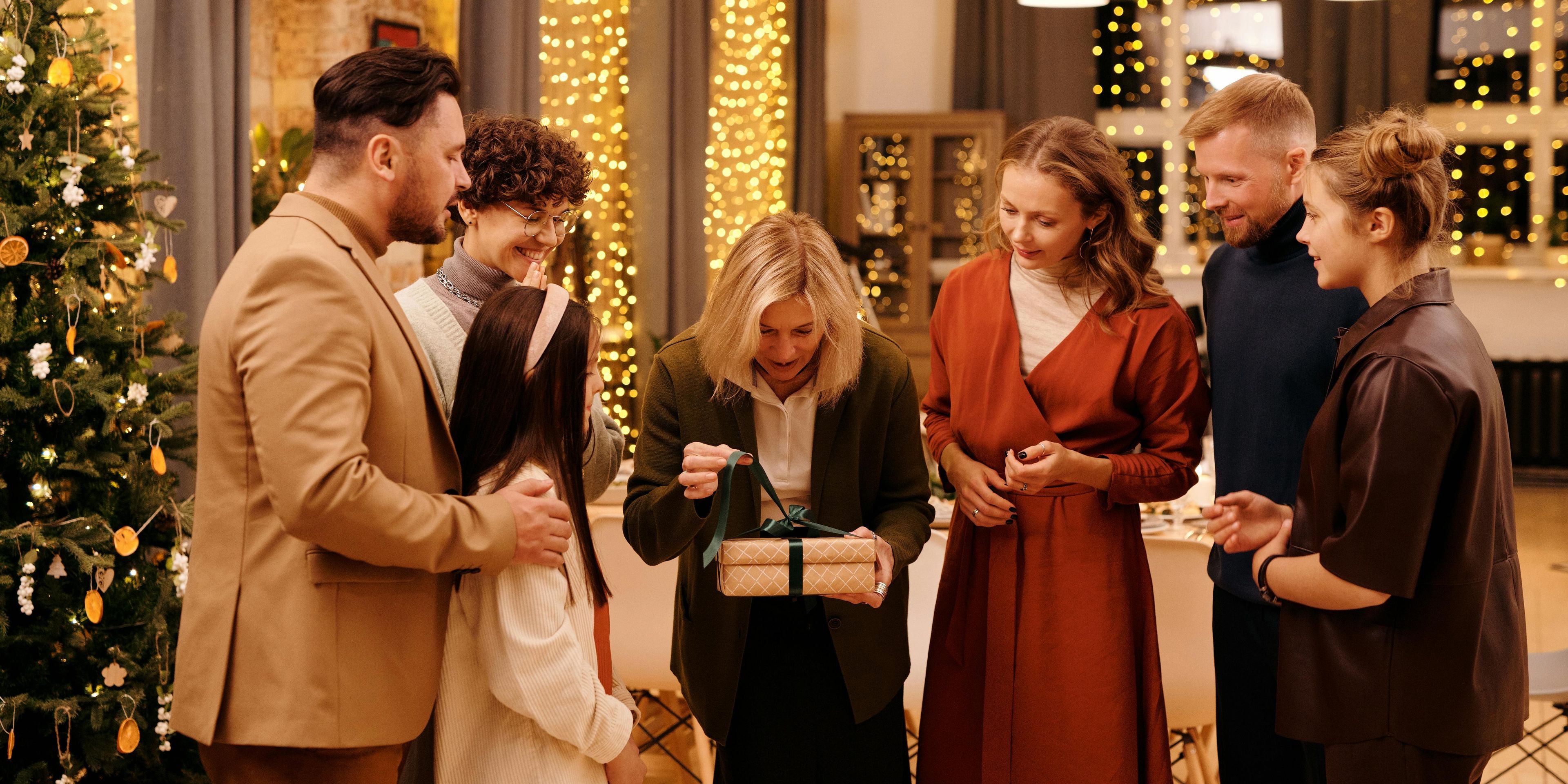 Family sharing holiday gift with Mother in Law