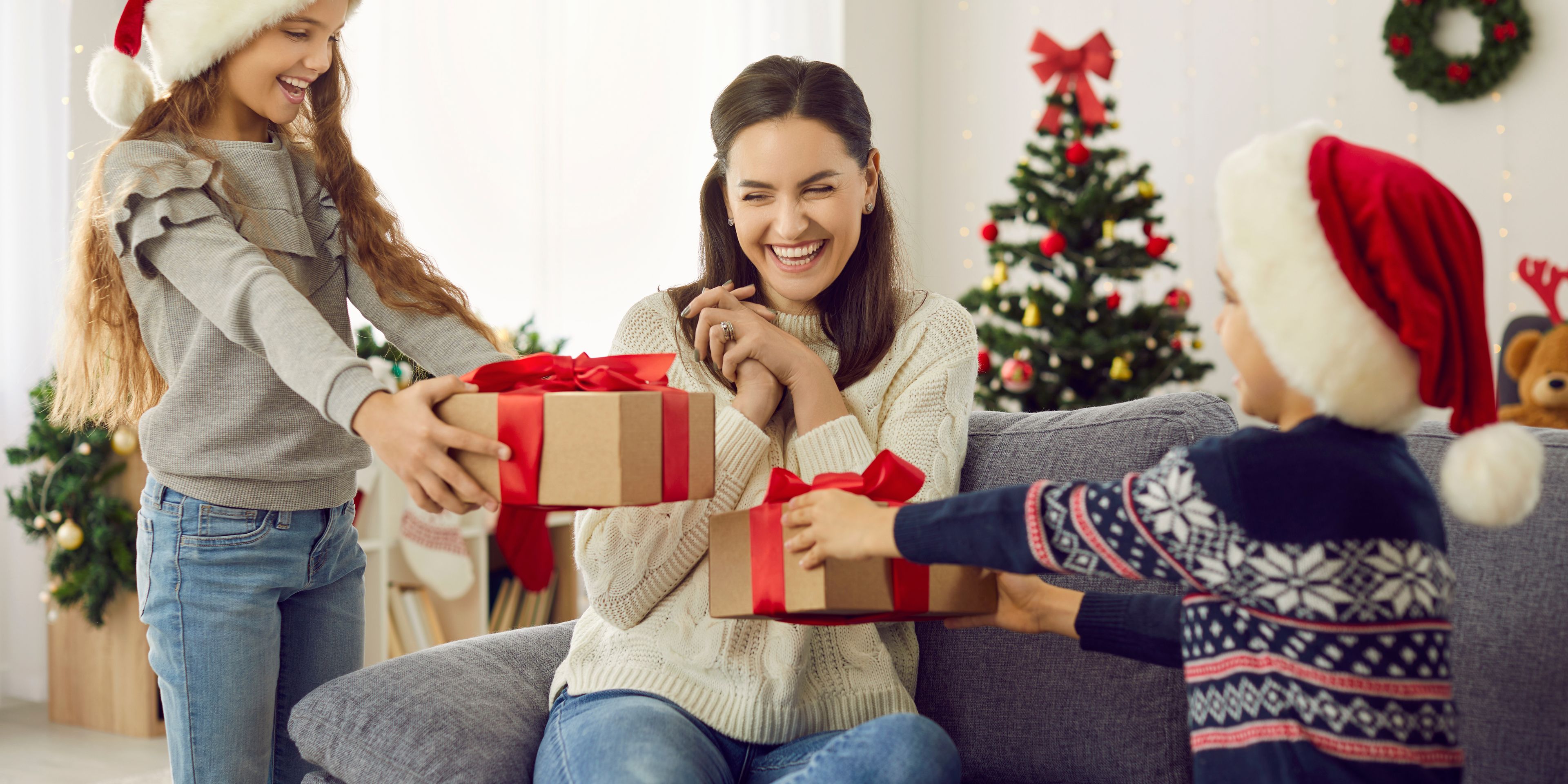 Kids giving Mom her Christmas gifts
