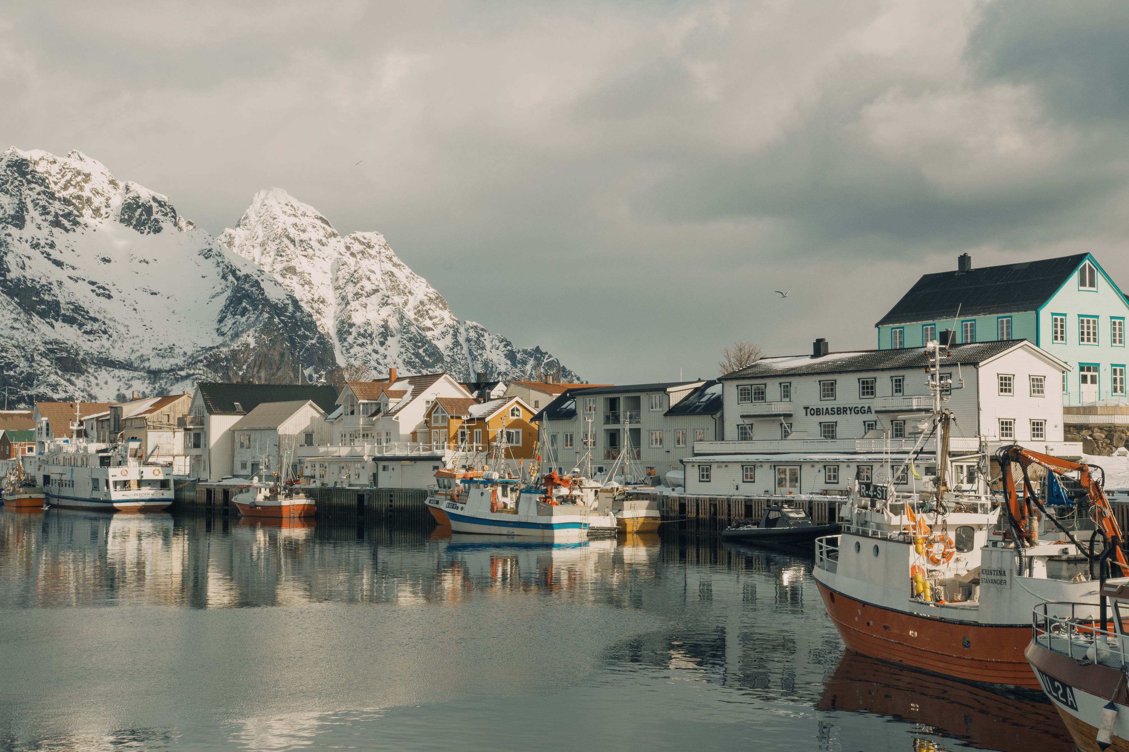 Fishing boats and harbor view from the molo in Henningsvær