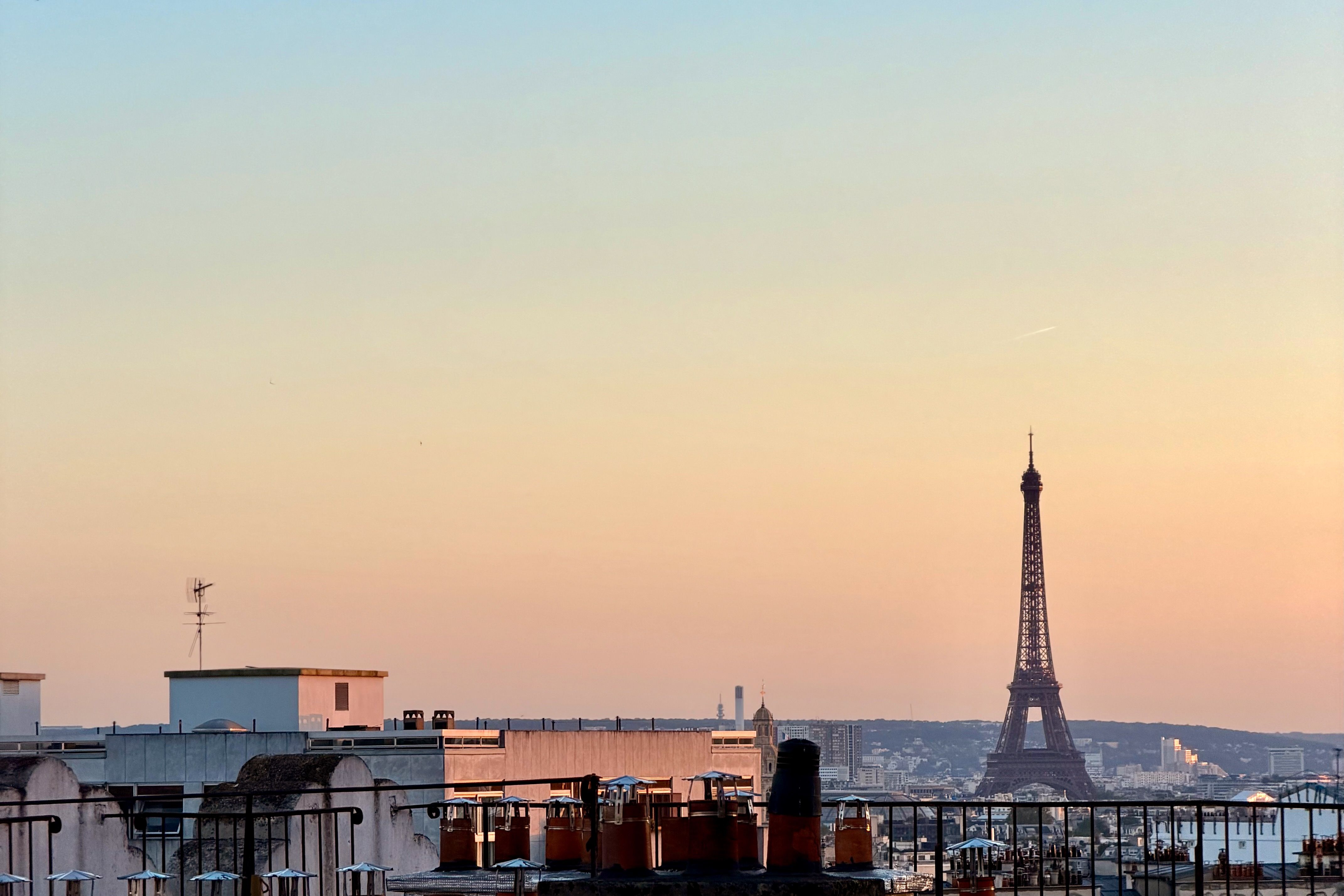 Parisian rooftop with Eiffel Tower in the distance