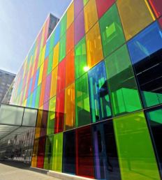 Facade of vividly coloured glass panels