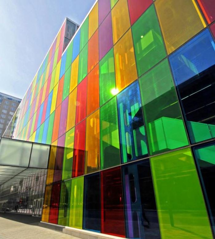 Building facade of vividly coloured architectural glass panels