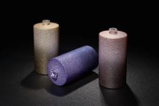 Three glitter-coated cylinder bottles