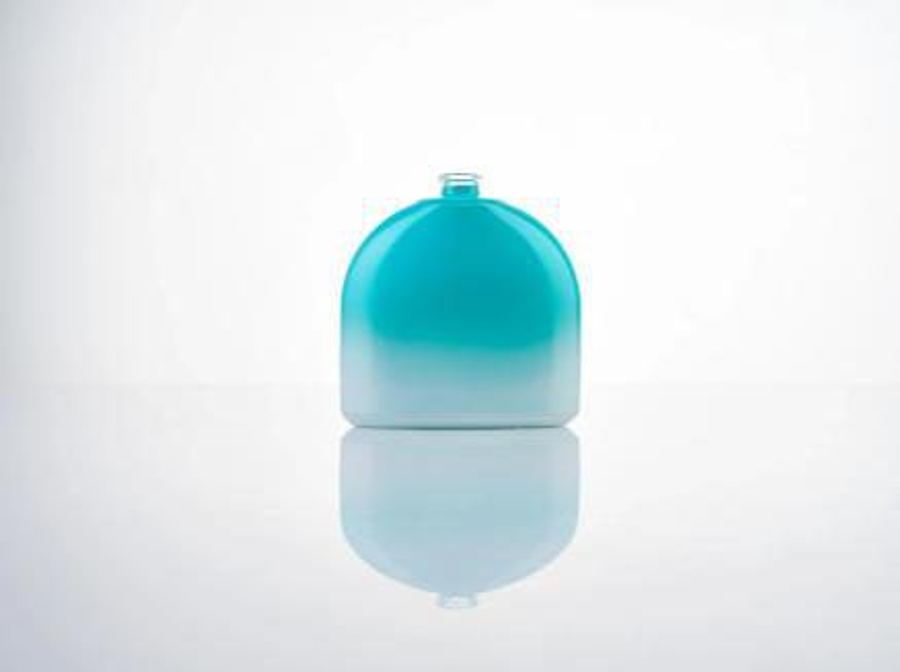 Teal water-based coating on a container glass bottle