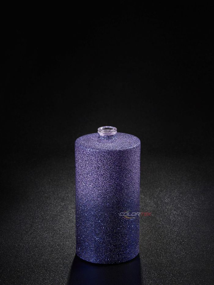 Purple glitter-finished glass bottle on a dark ground