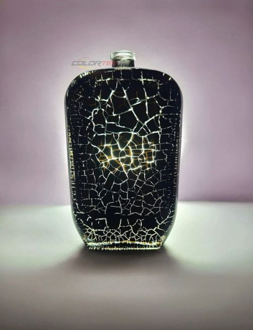 Black crackle-finish coated bottle glowing from within