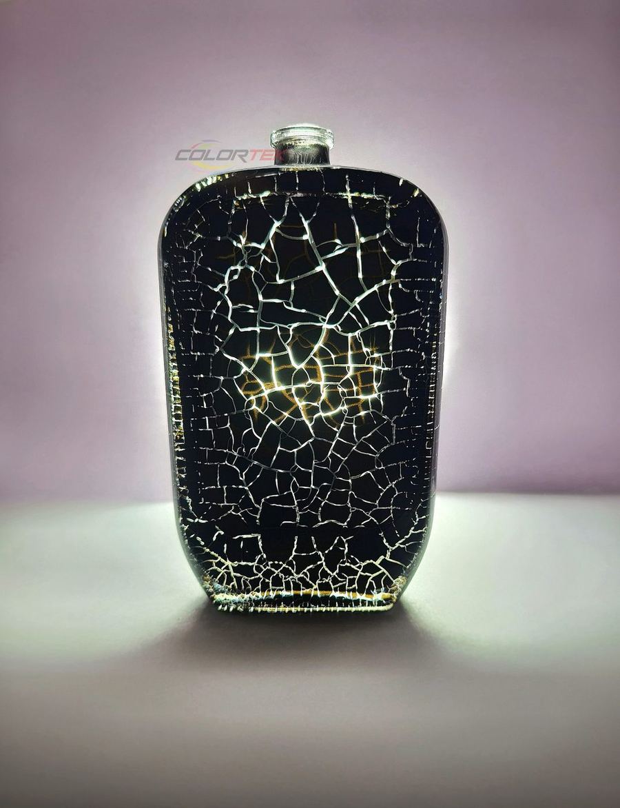 Black crackle-finish coated bottle glowing from within