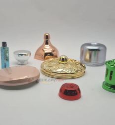 Coated cosmetic caps in rose gold, chrome and red