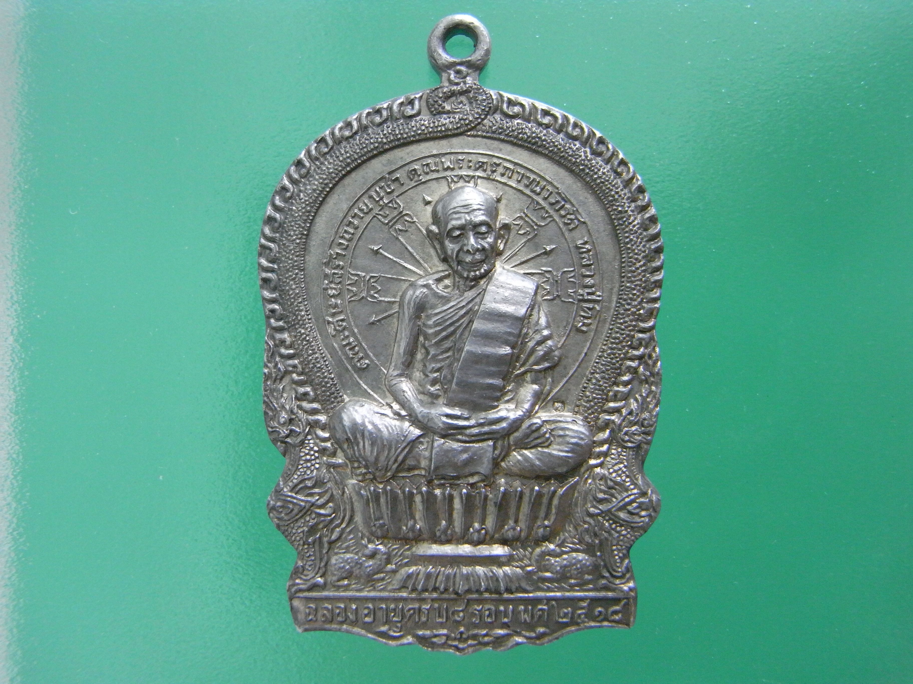 Front view of Luang Pu Thim Rian Nang Phan Silver Amulet, AC168-0003