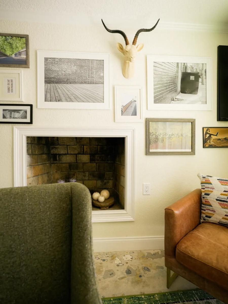 Restored original fireplace with a gallery wall