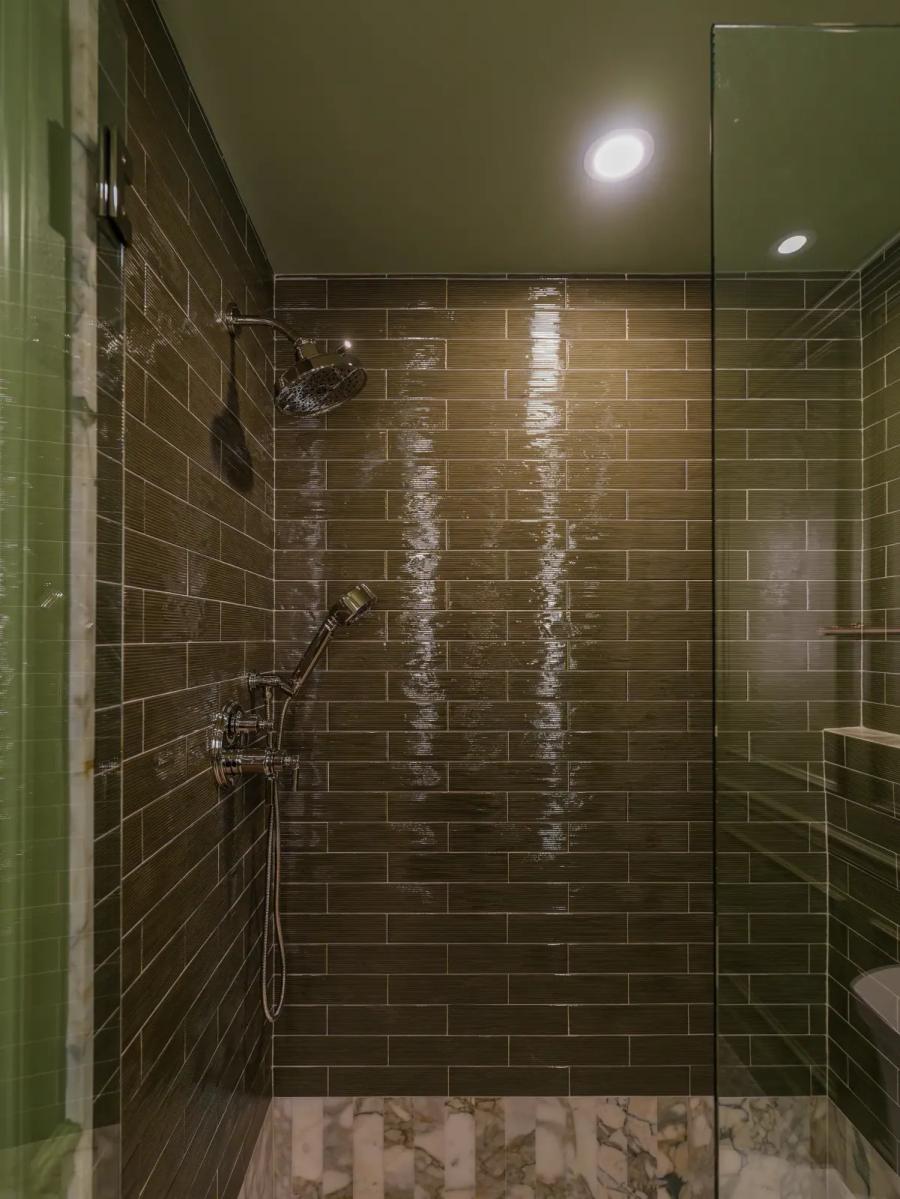 Olive glazed-tile shower