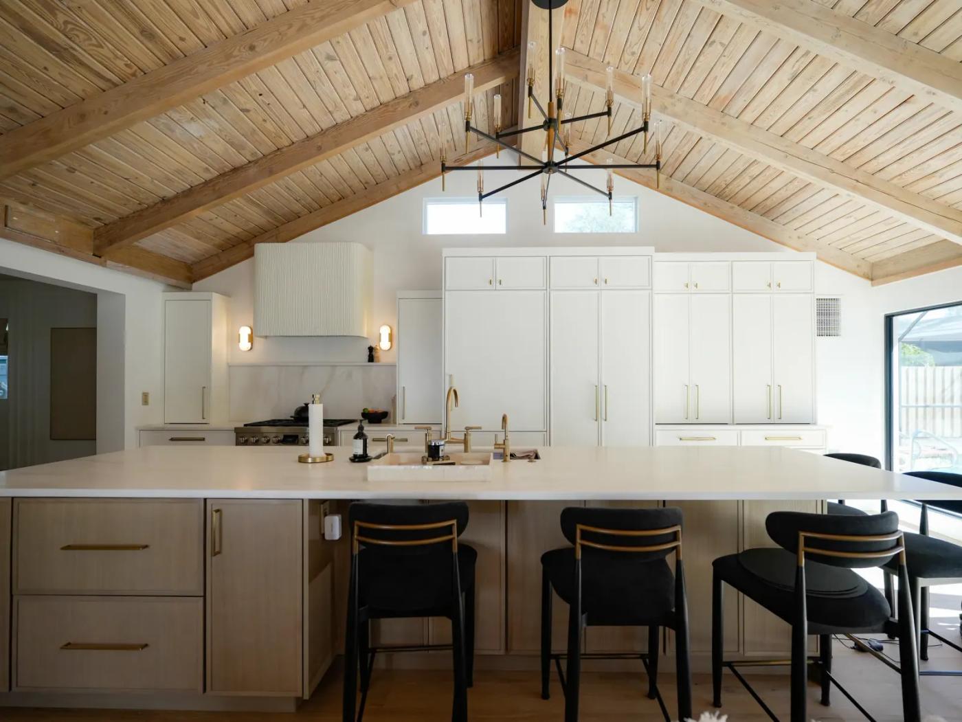 Vaulted kitchen with a tongue-and-groove ceiling and island seating
