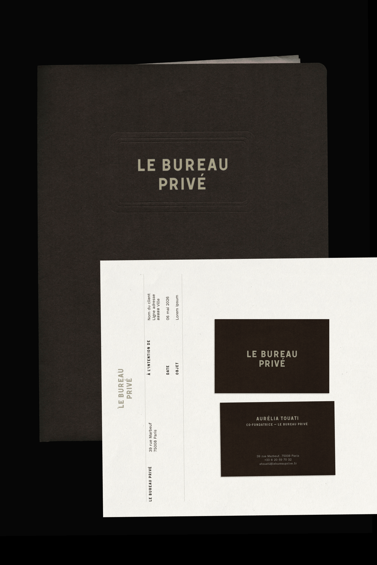 Dark brown folders and cards stacked together, showing the "Le Bureau Privé" logo alongside printed documents and a business card on a black background.